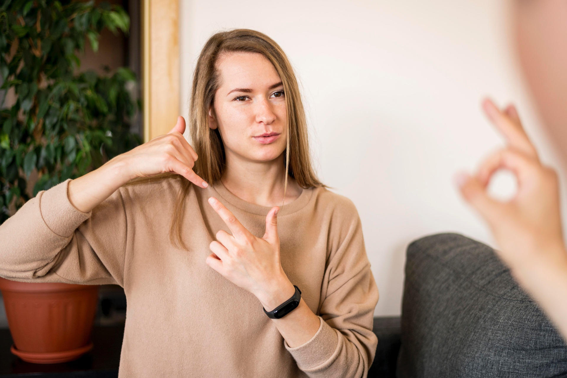 Woman communicating in sign language.