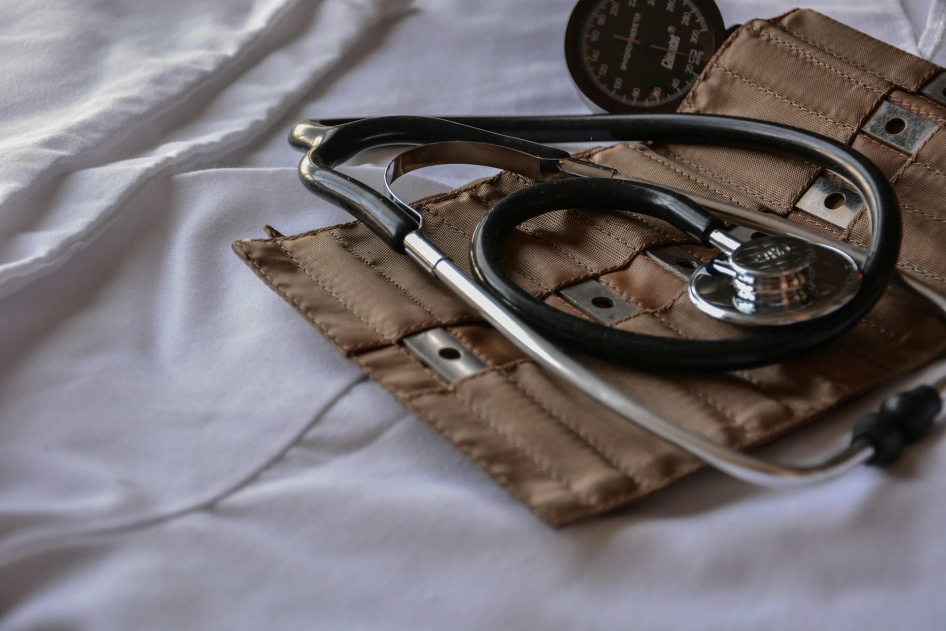 Nursing tools on a hospital bed.