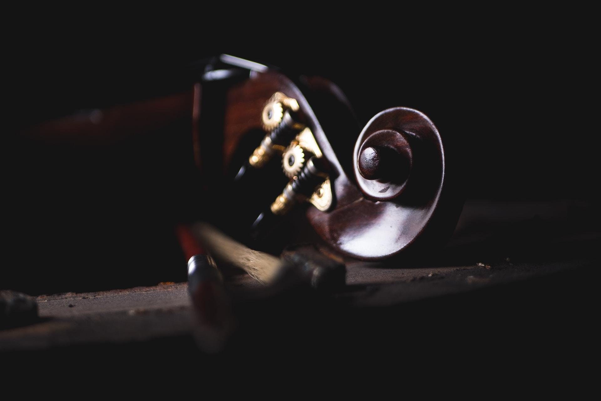 A closeup of a violin scroll.