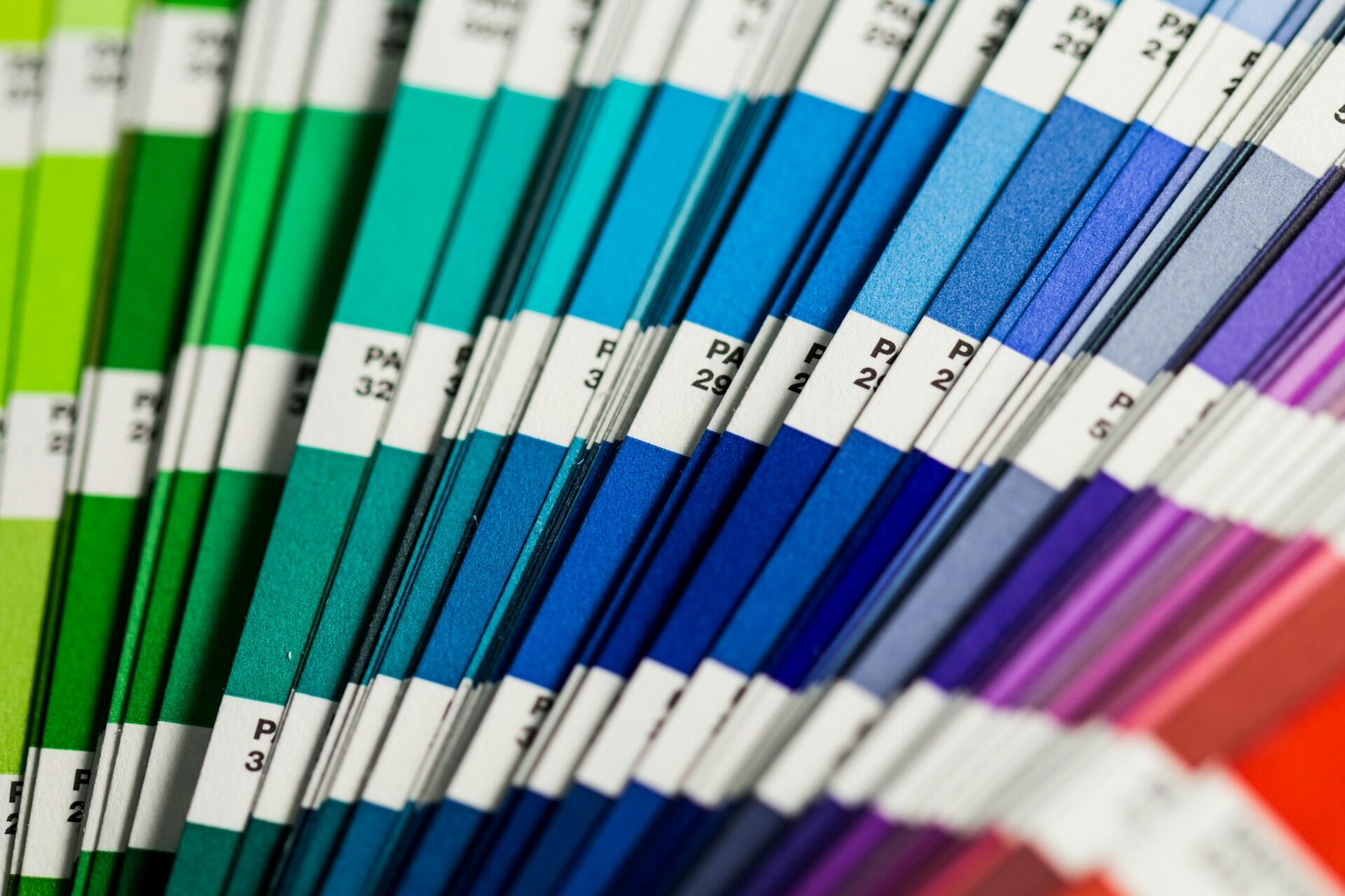 Fan of colour swatch cards arranged in gradient shades