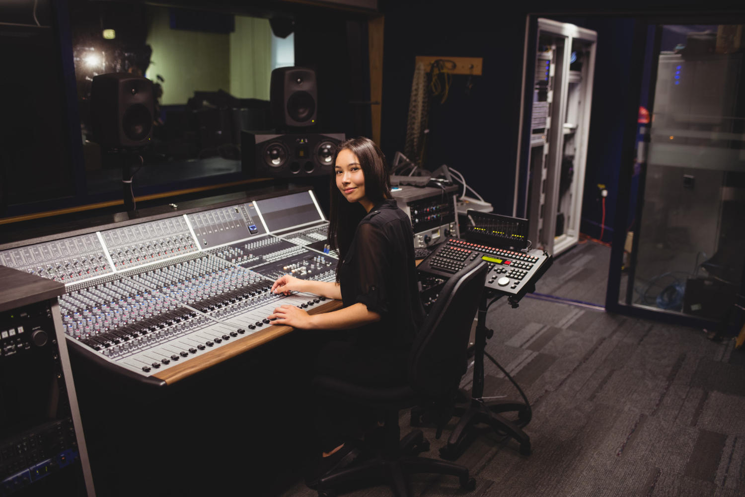 Student using a large sound mixer