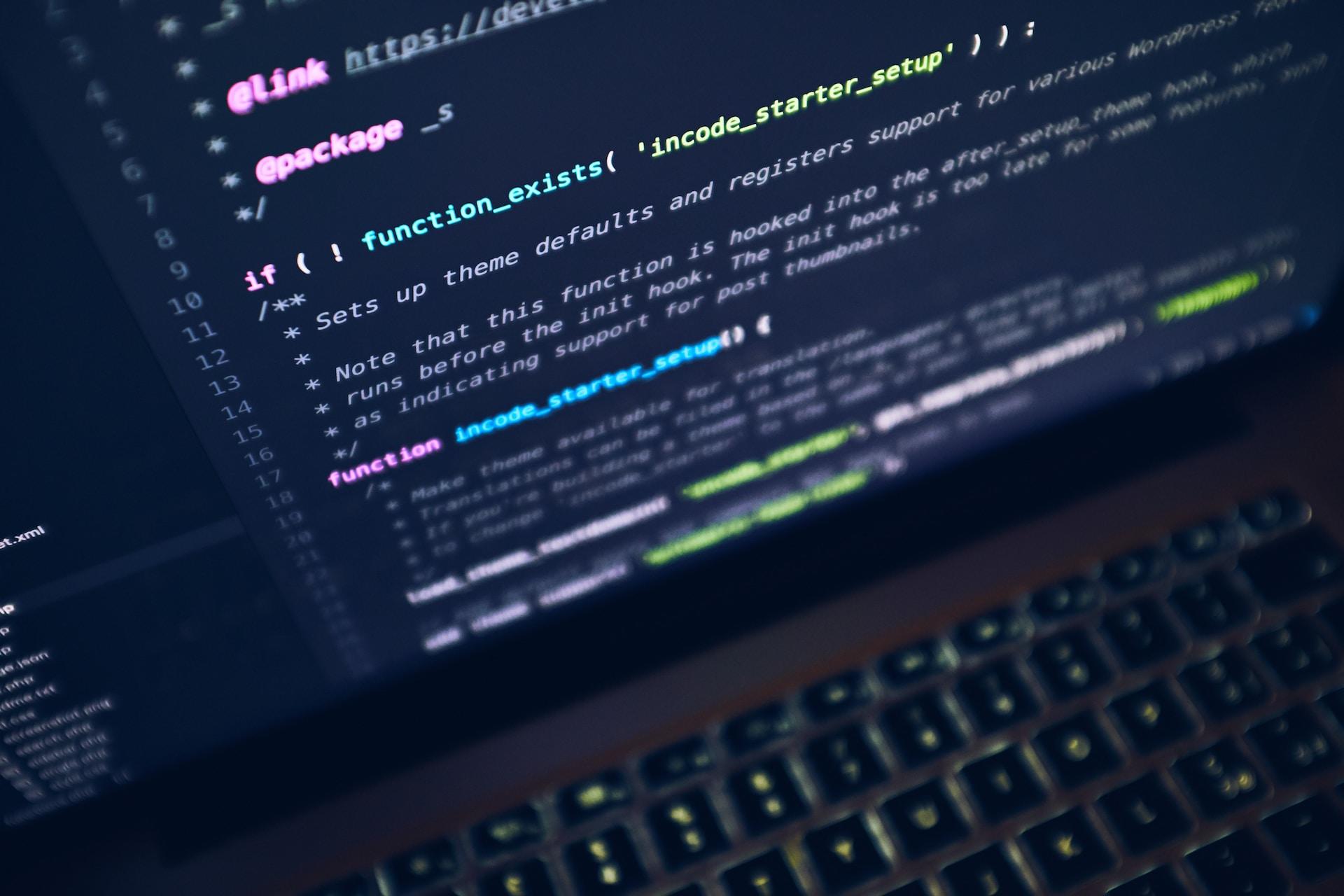 A laptop screen with computer code and a function.