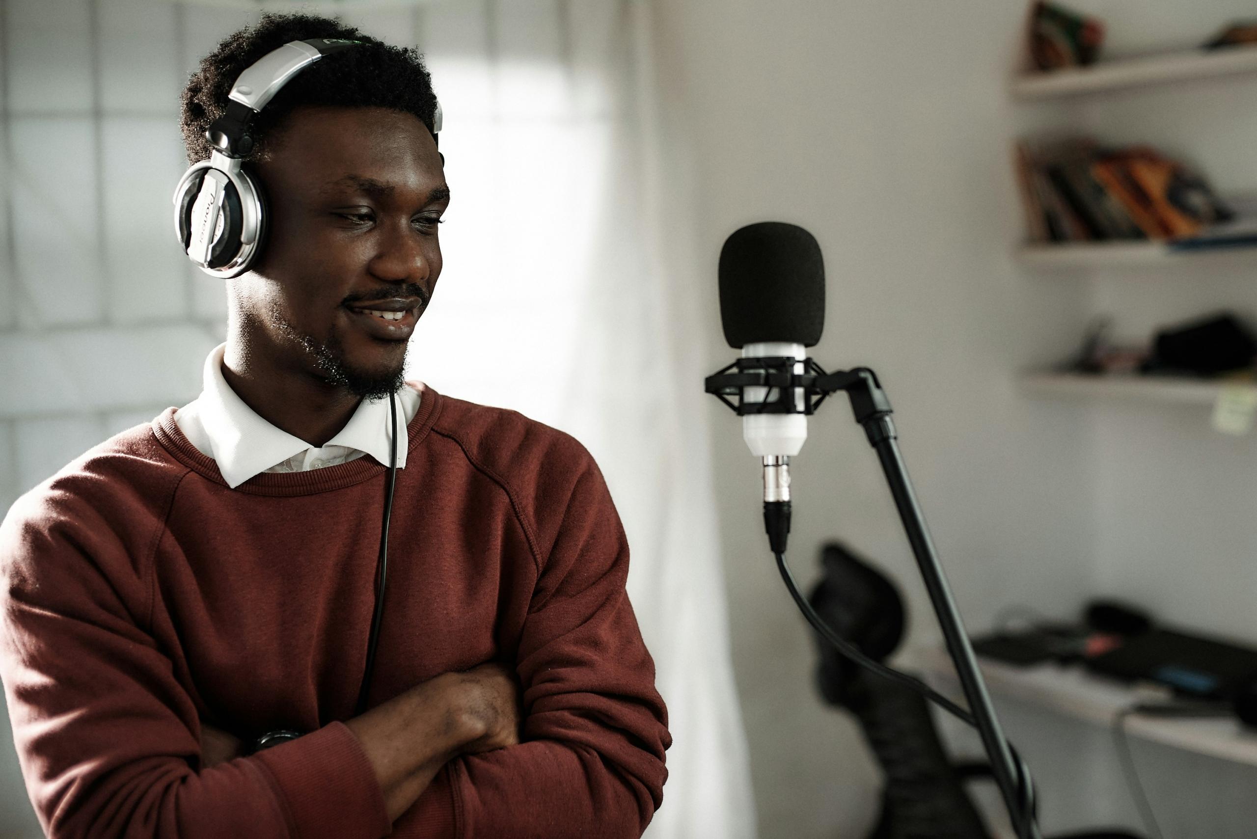 man standing in front of a microphone