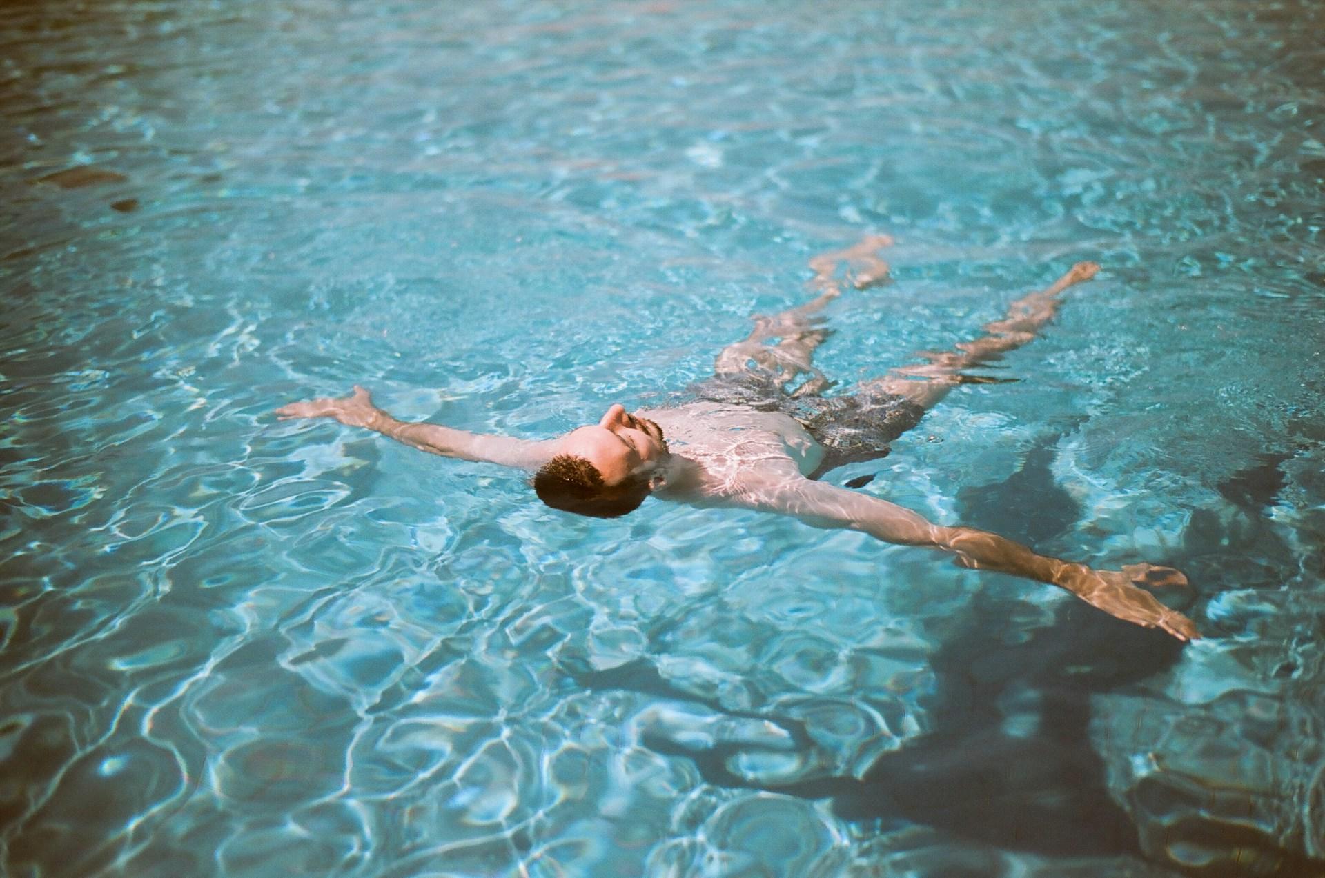 the man relaxing in pool