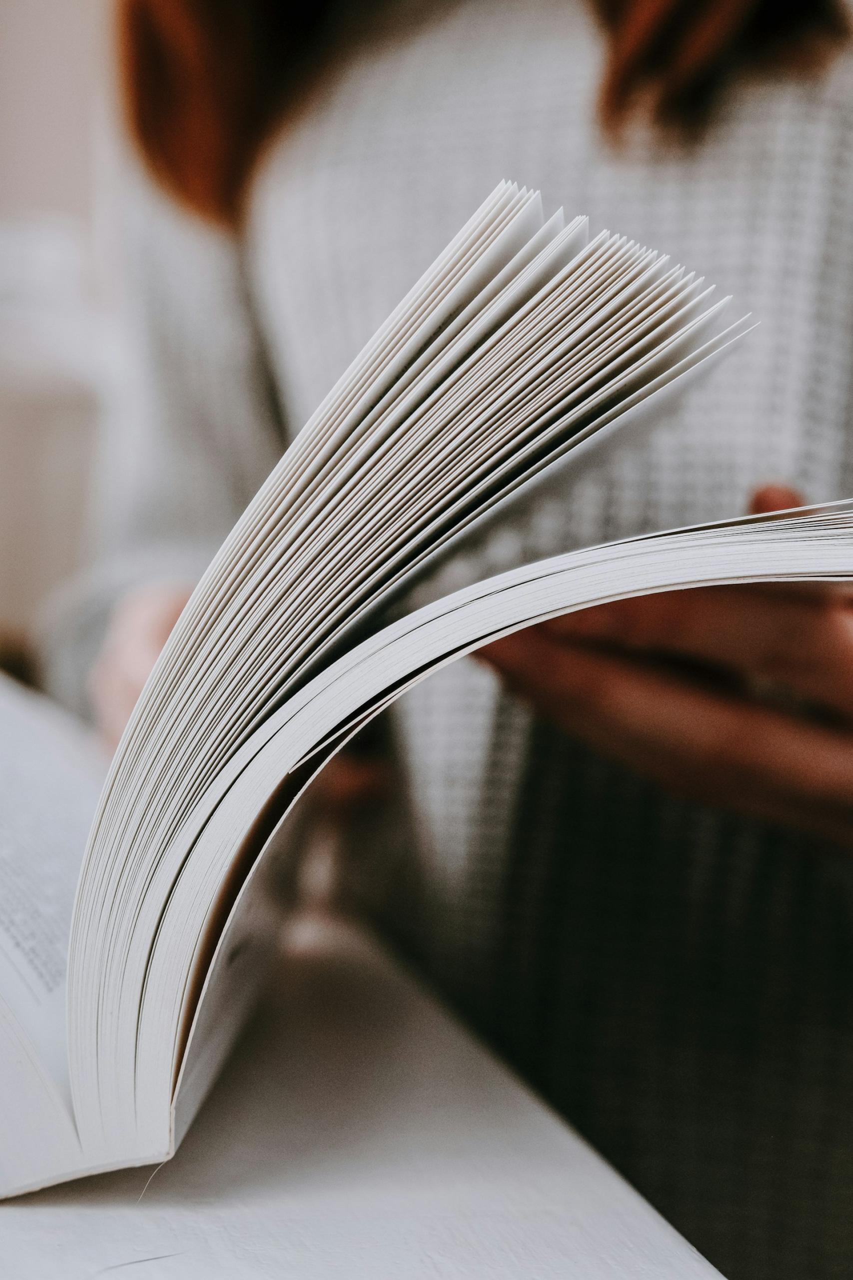 woman flipping through a book