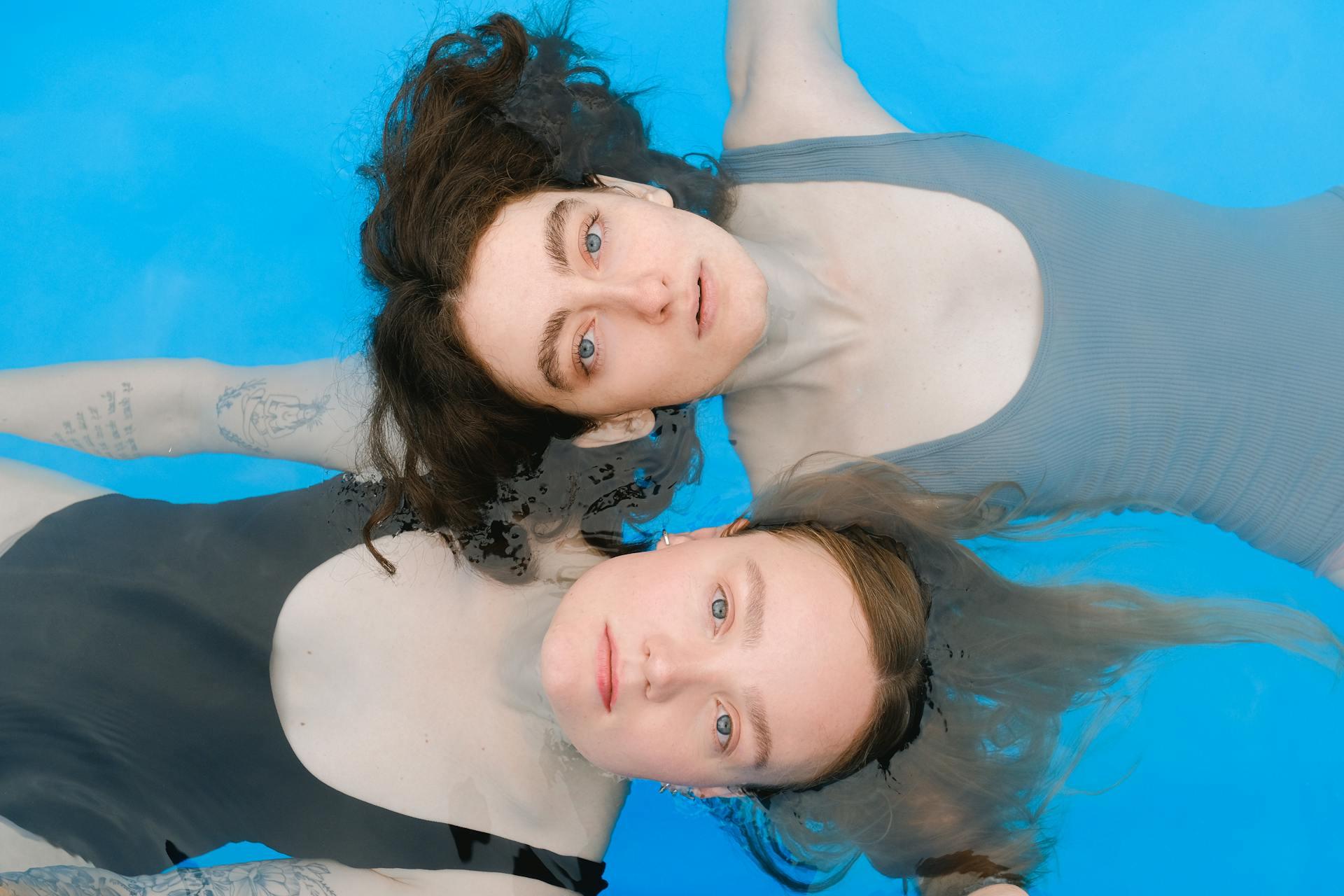 two ladies floating on water and best swim exercises
