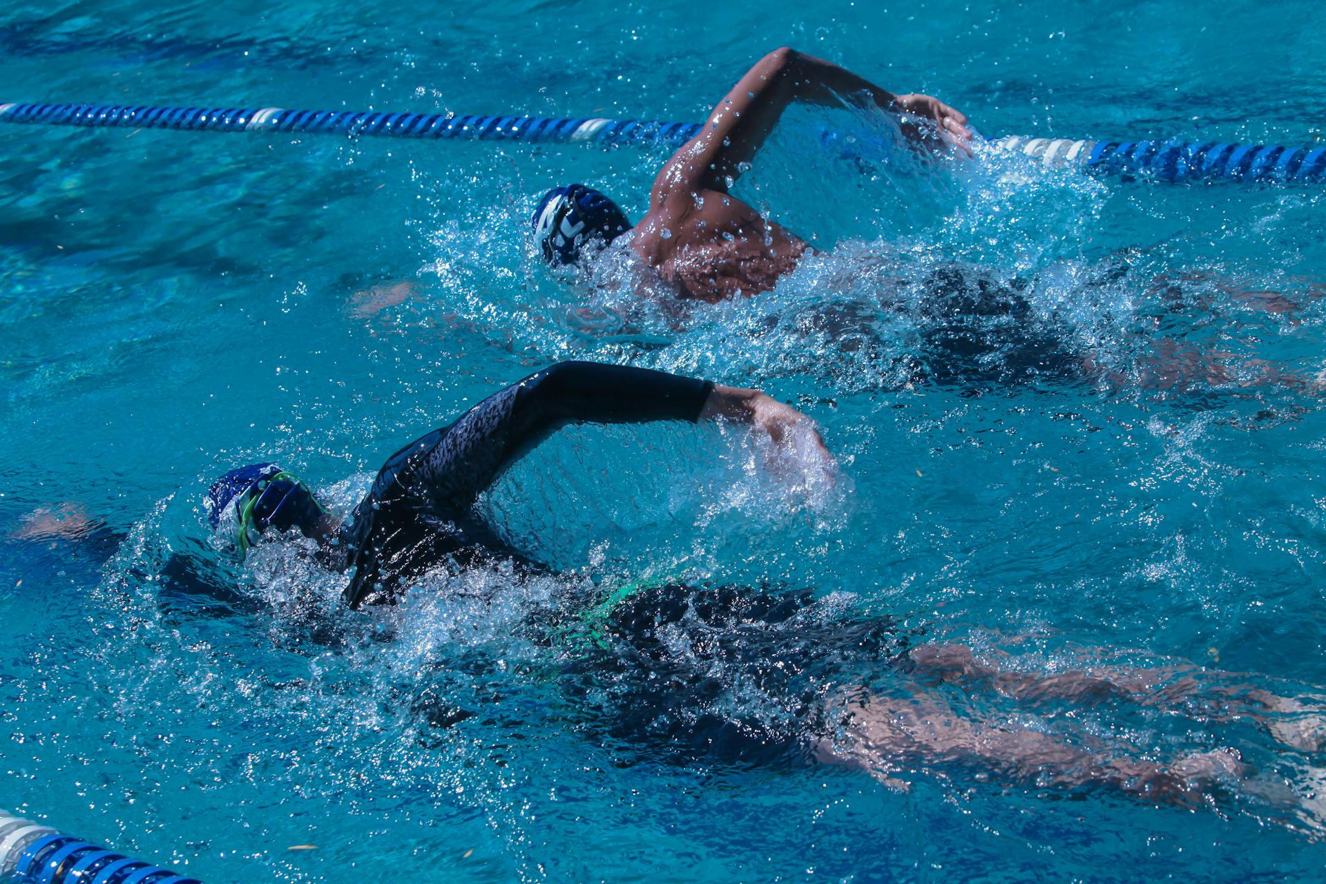 Two people swimming together
