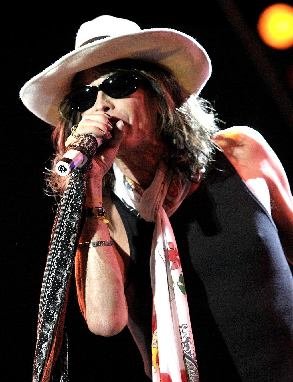 Steven Tyler on stage performing.