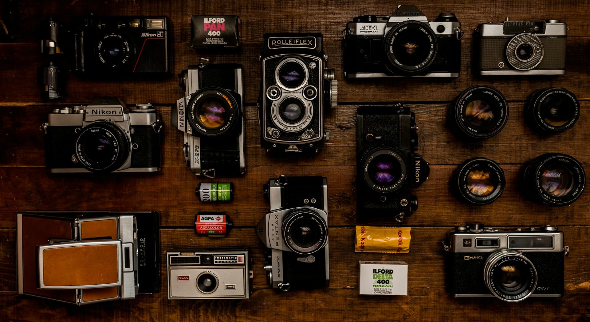 Multiple cameras on a table.