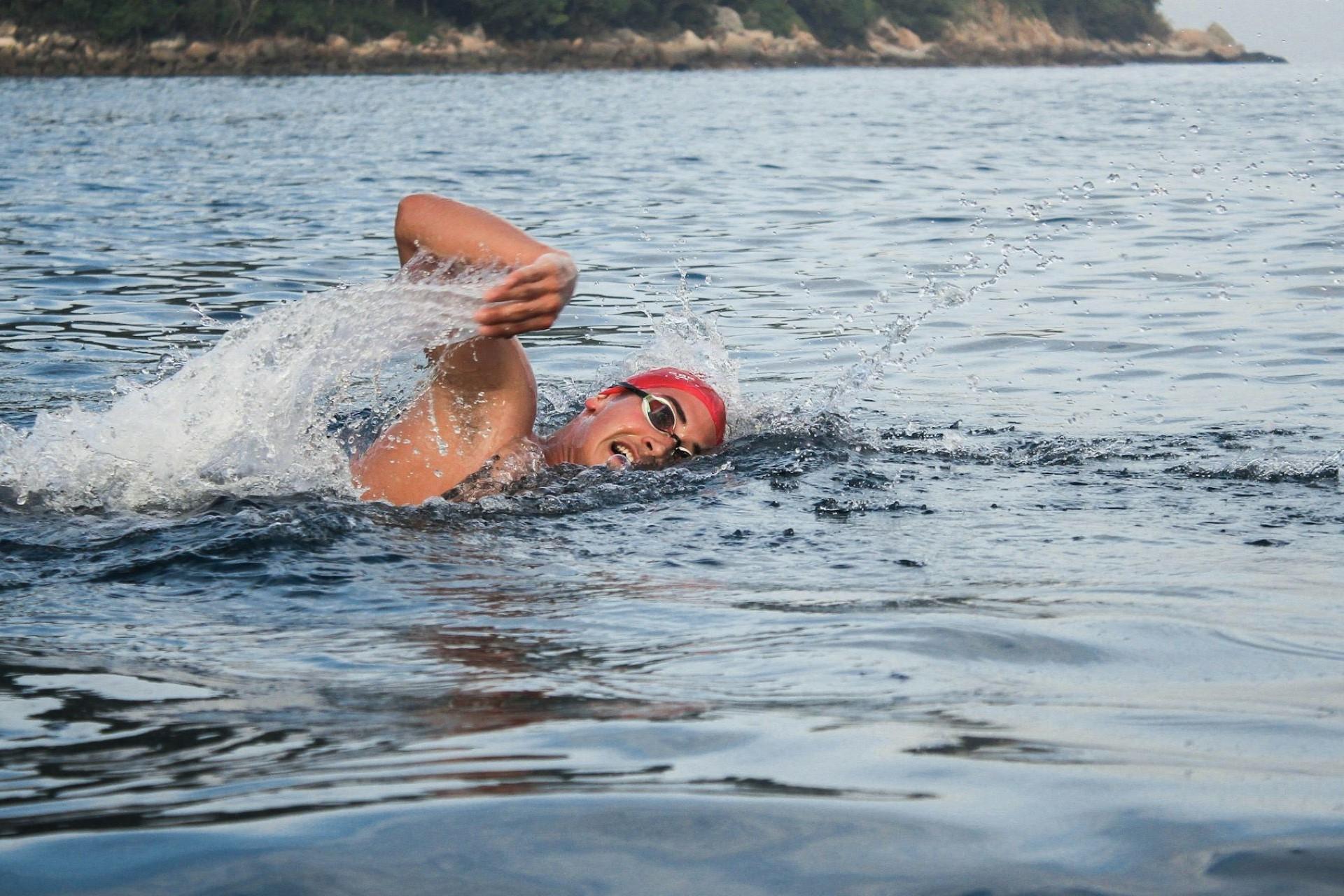A man swimming in the sea.