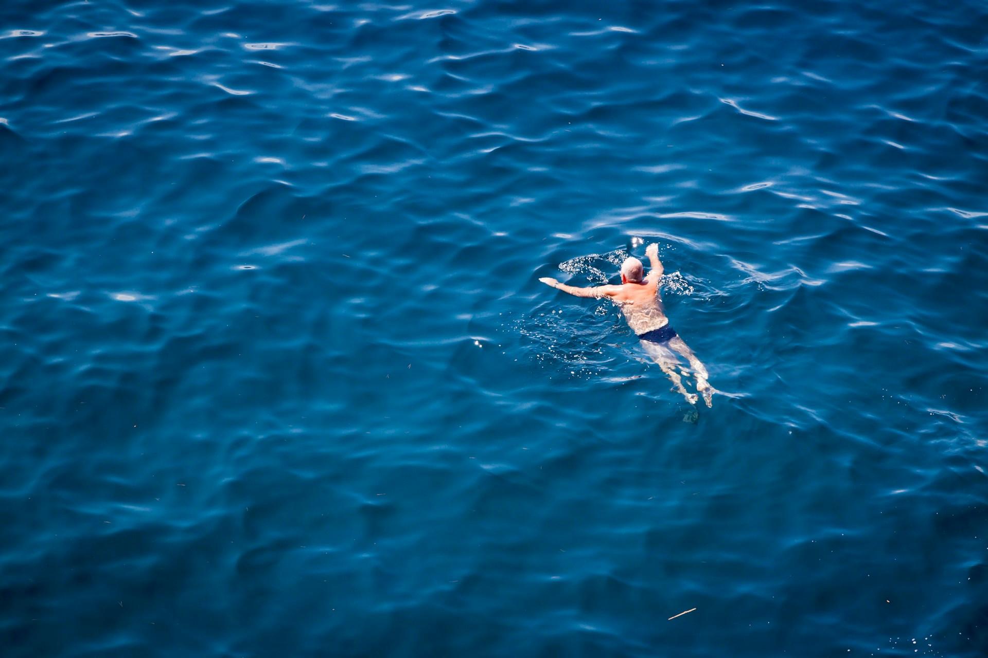 A man swimming in Dubrovnik, Croatia.