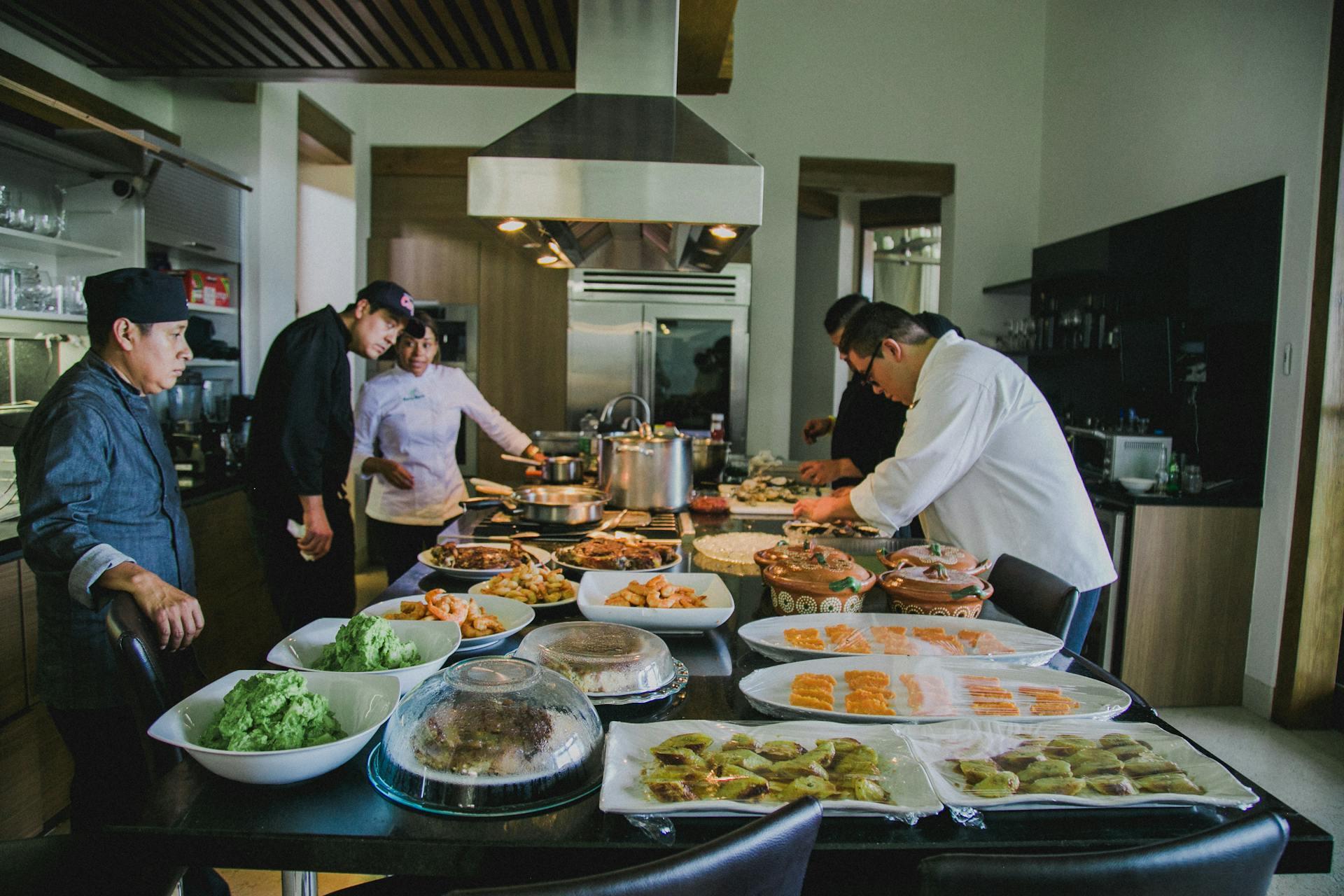 chefs preparing foods for customers