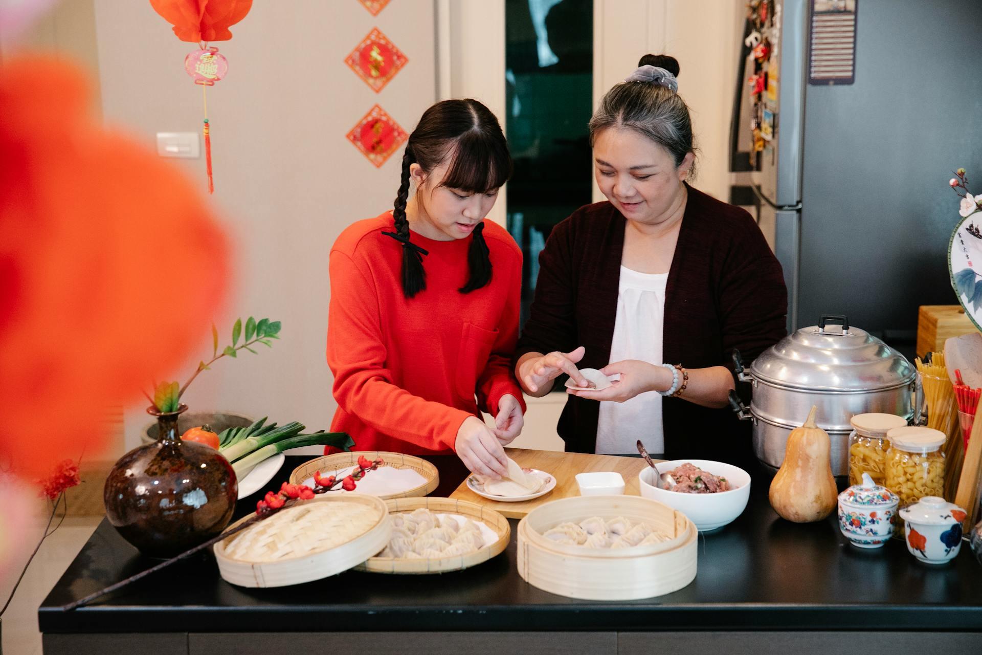 two woman preparing food