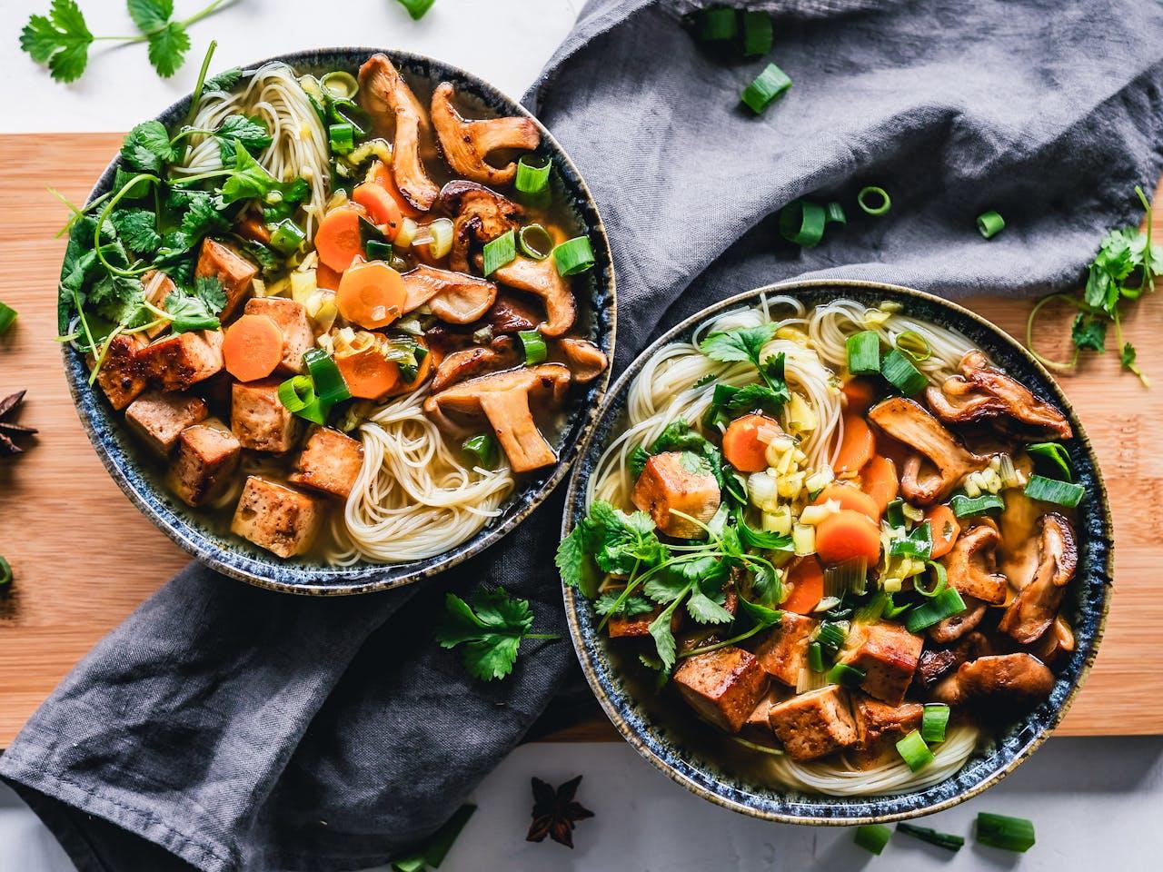 two bowls of cooked food