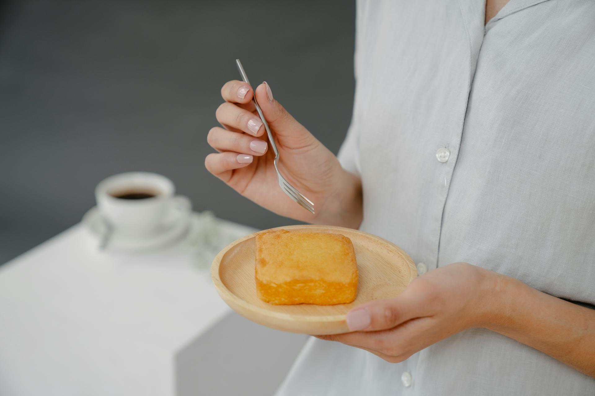 a woman eating a cake