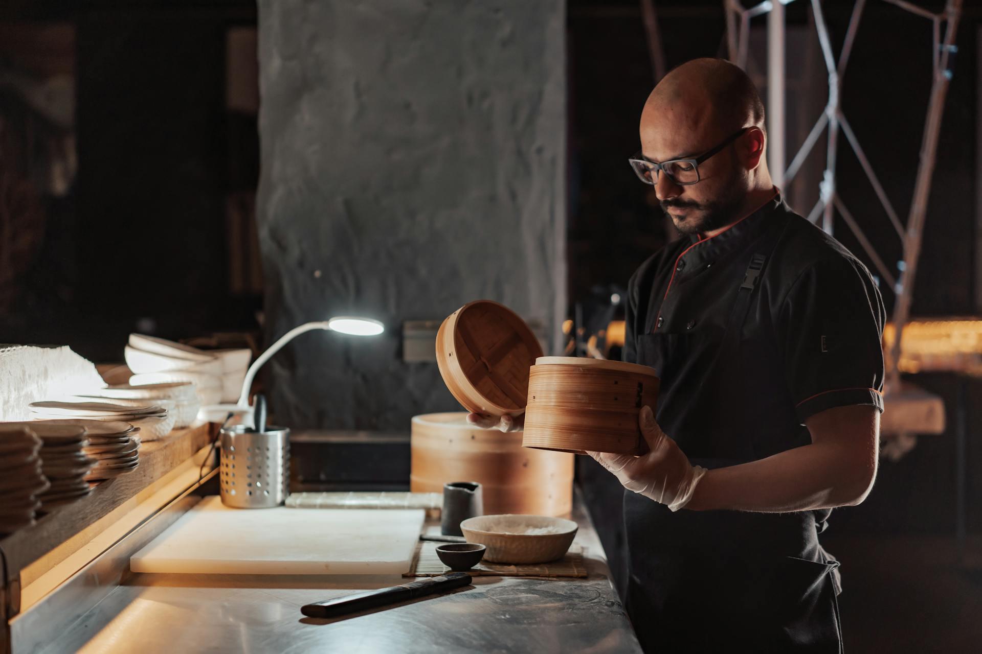 a man checking bamboo steamer