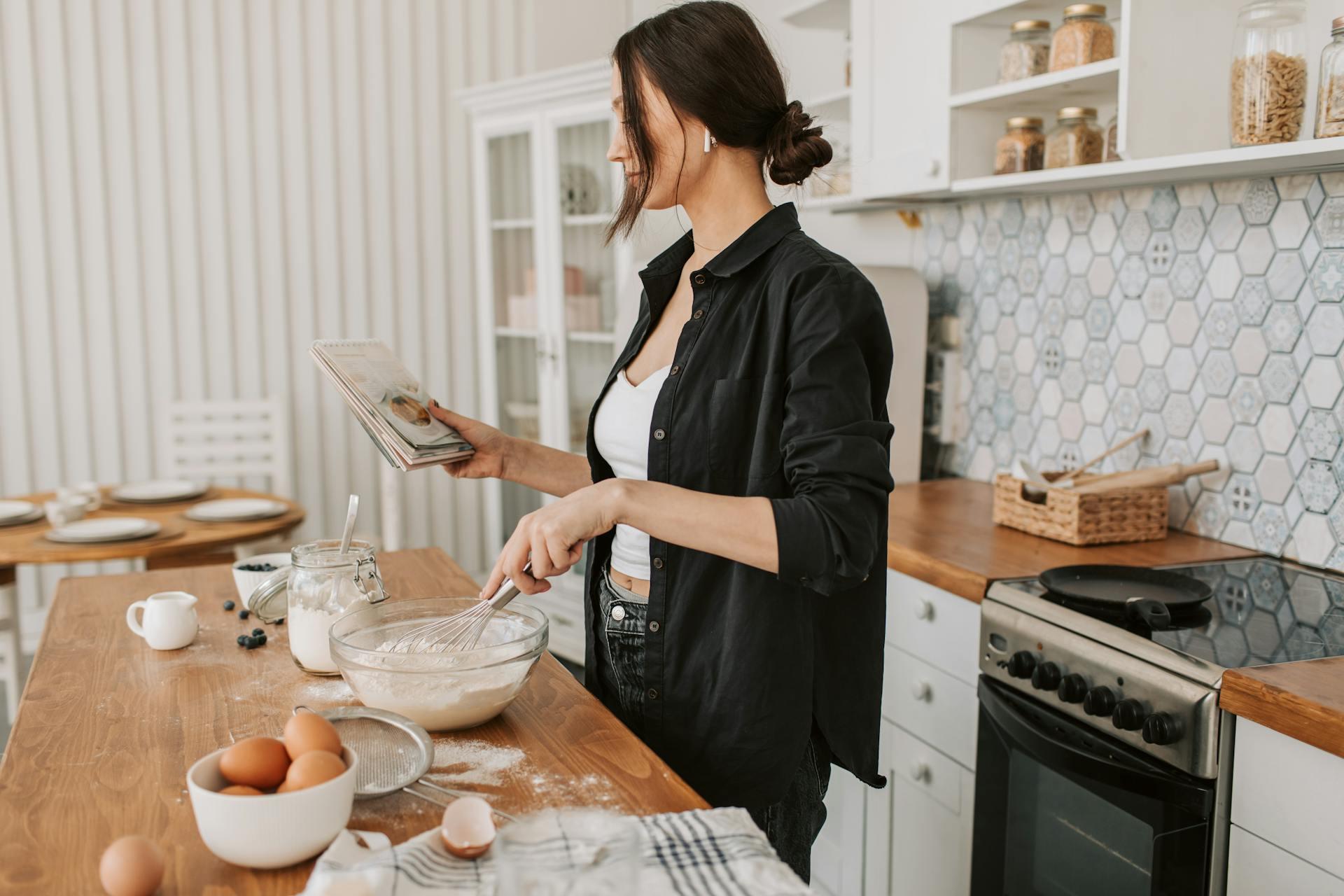 a lady checking cooking book
