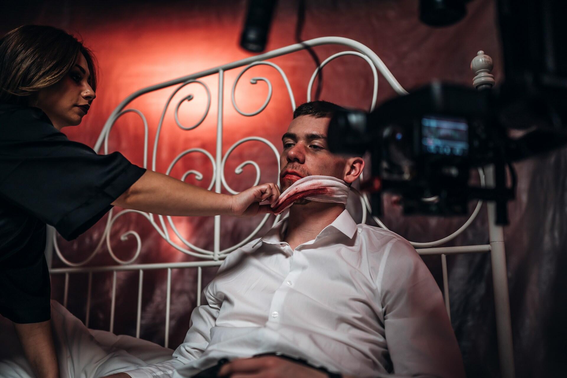 An actor playing an ill or injured character in bed.