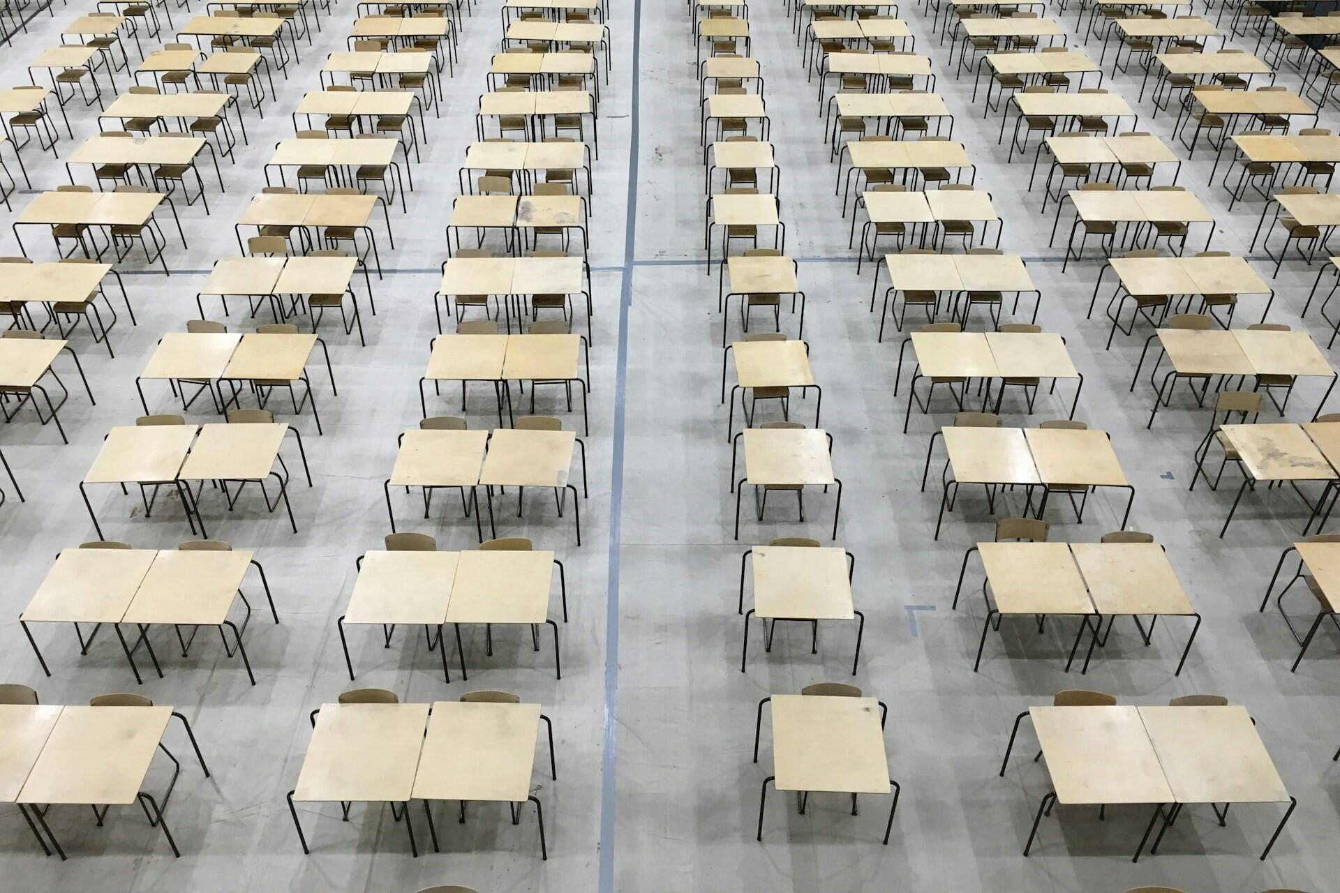 A hall set up for an exam.