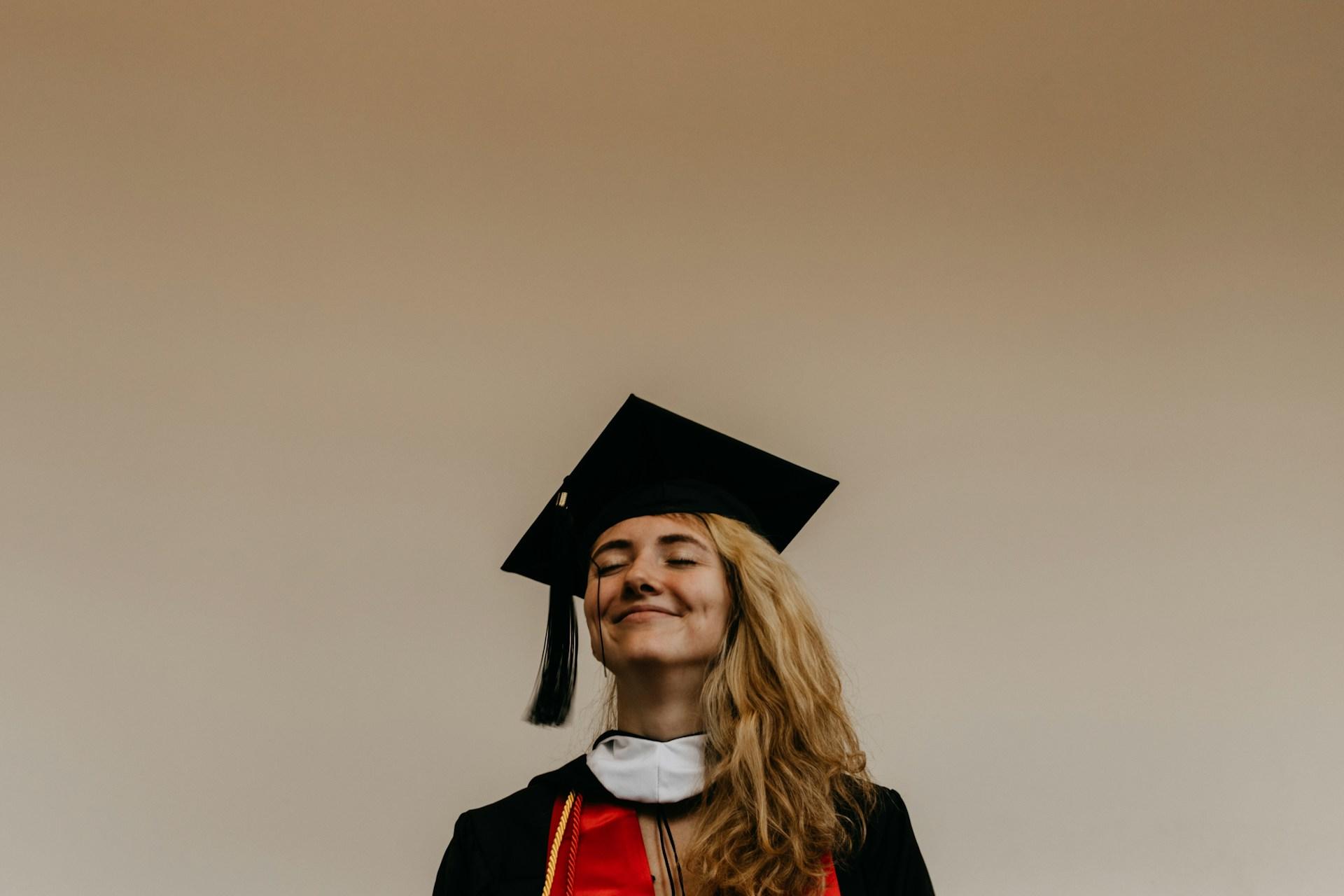 female graduate student with graduation cap