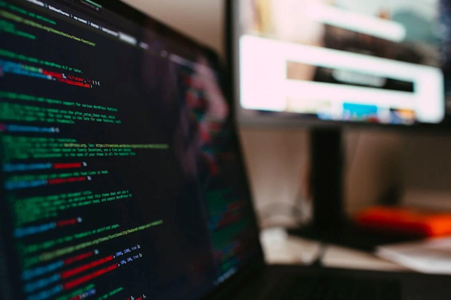 Colorful Python code displayed on a laptop screen