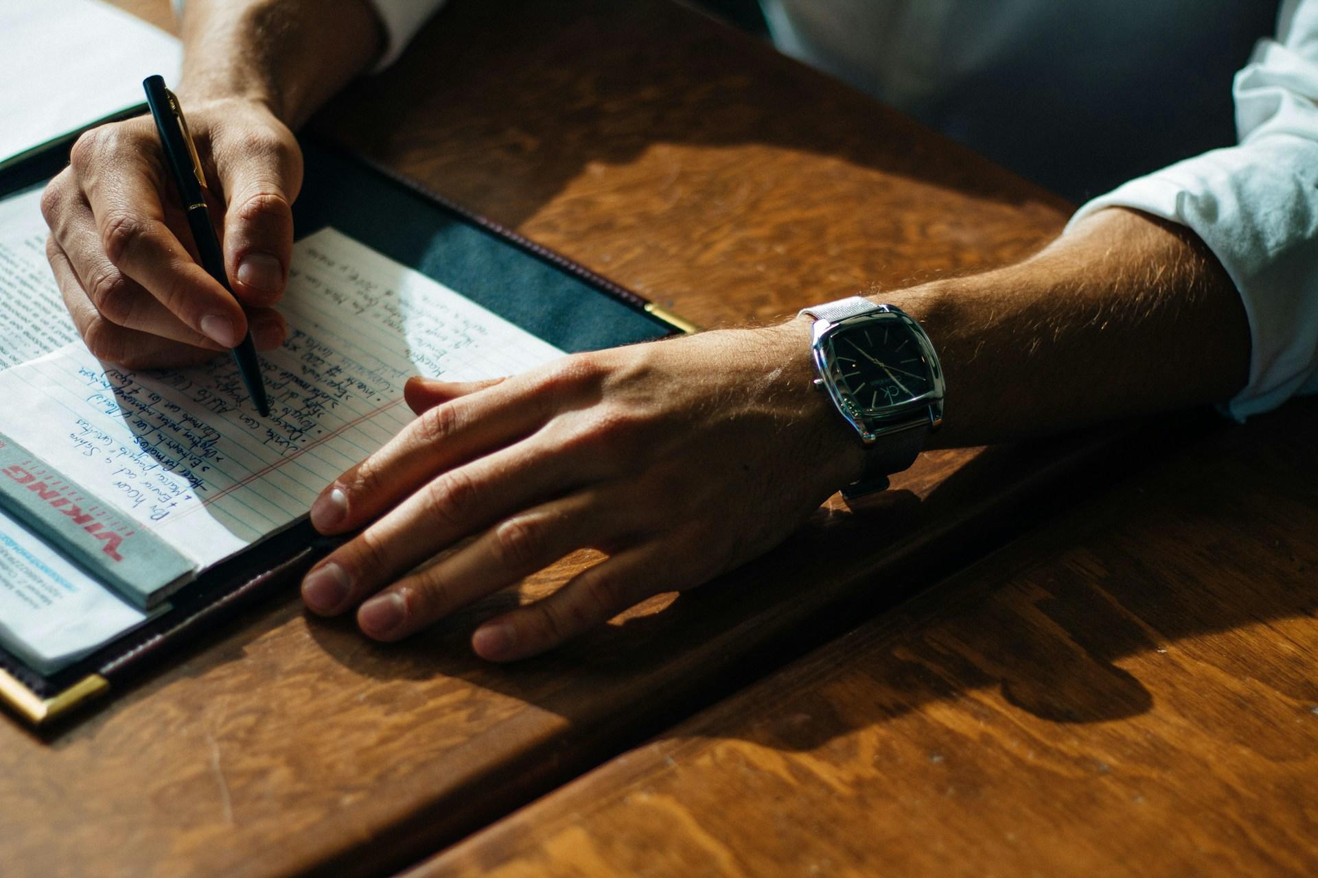 A person taking notes.