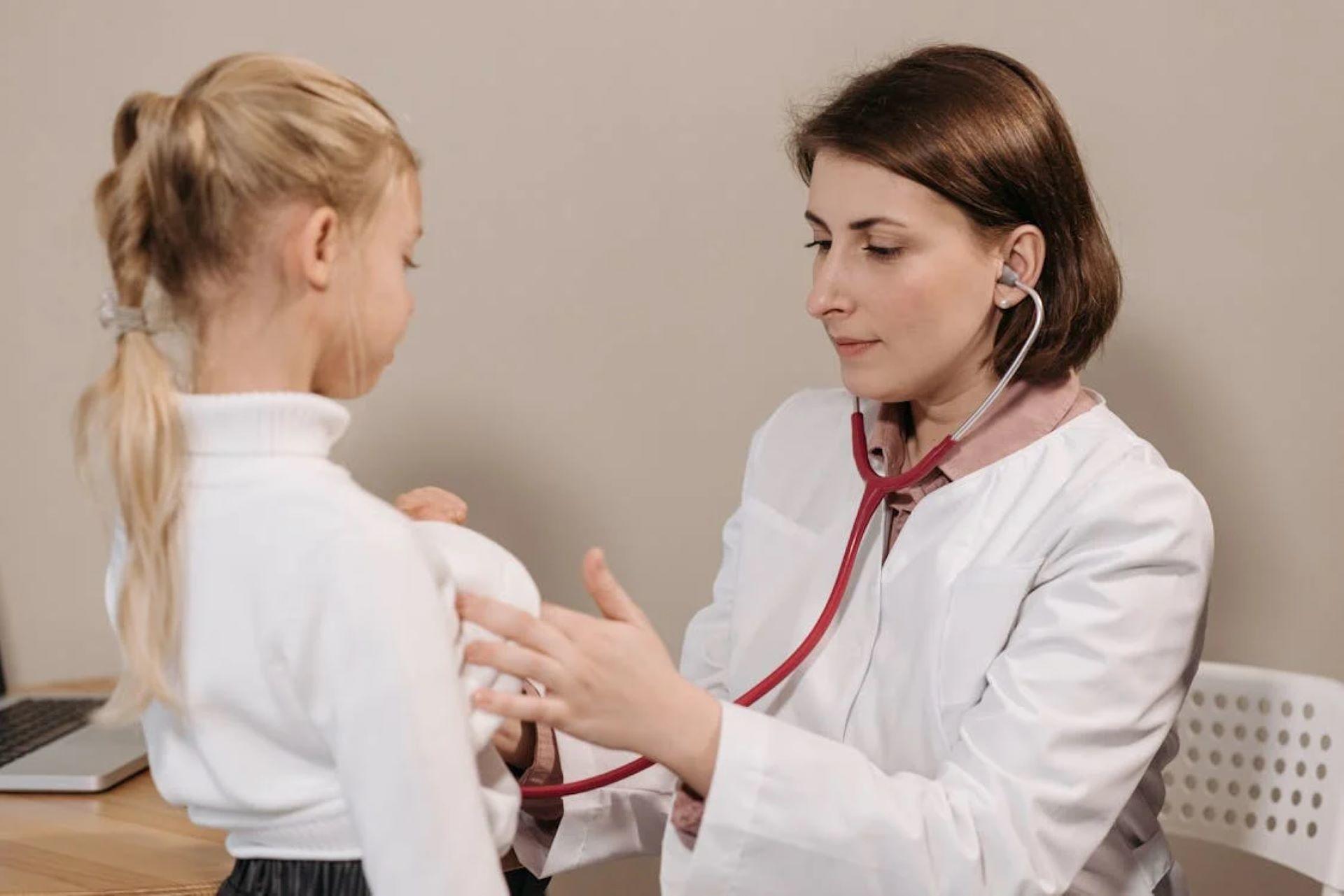 Paediatrician examining the child's chest with a stethoscope