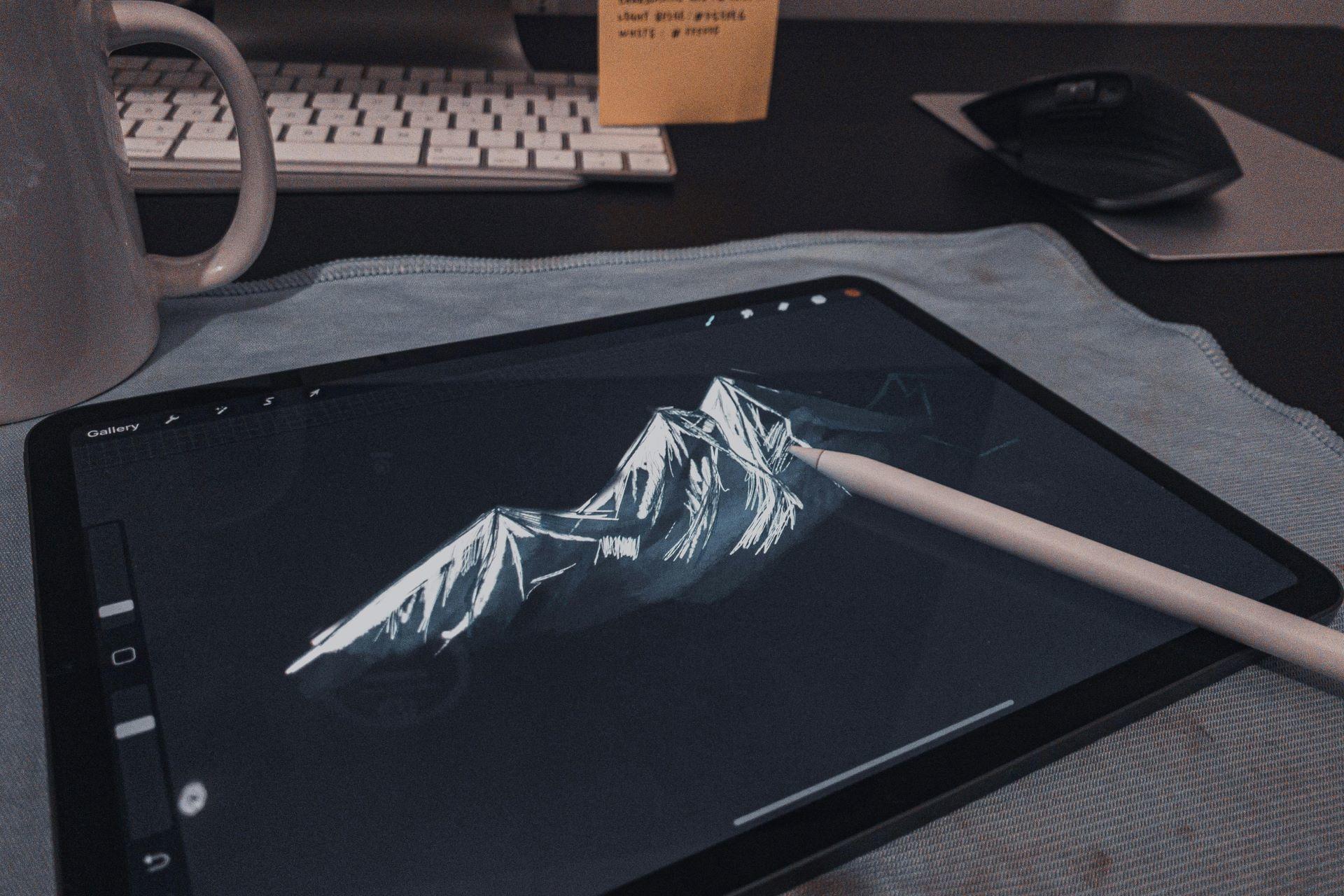 A tablet with a pen resting on its surface