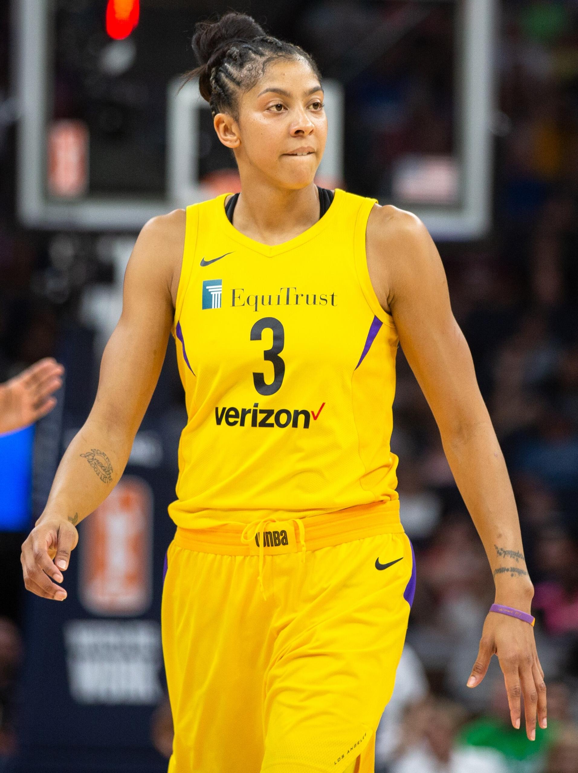 Candace Parker walking on basketball court.