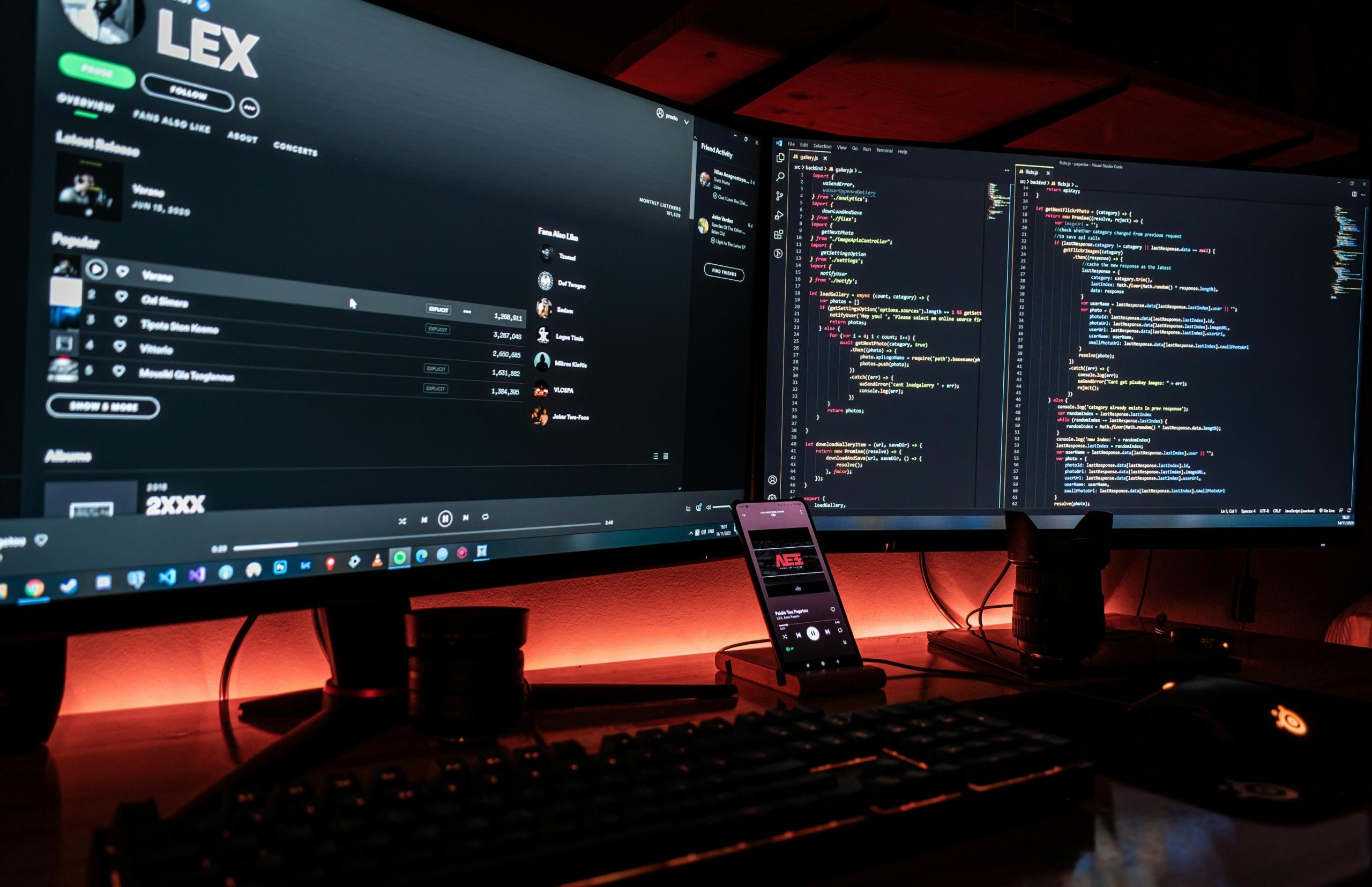 A bunch of computer screens showing coding