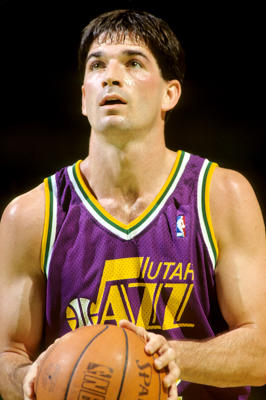 John Stockton about to throw the basketball.