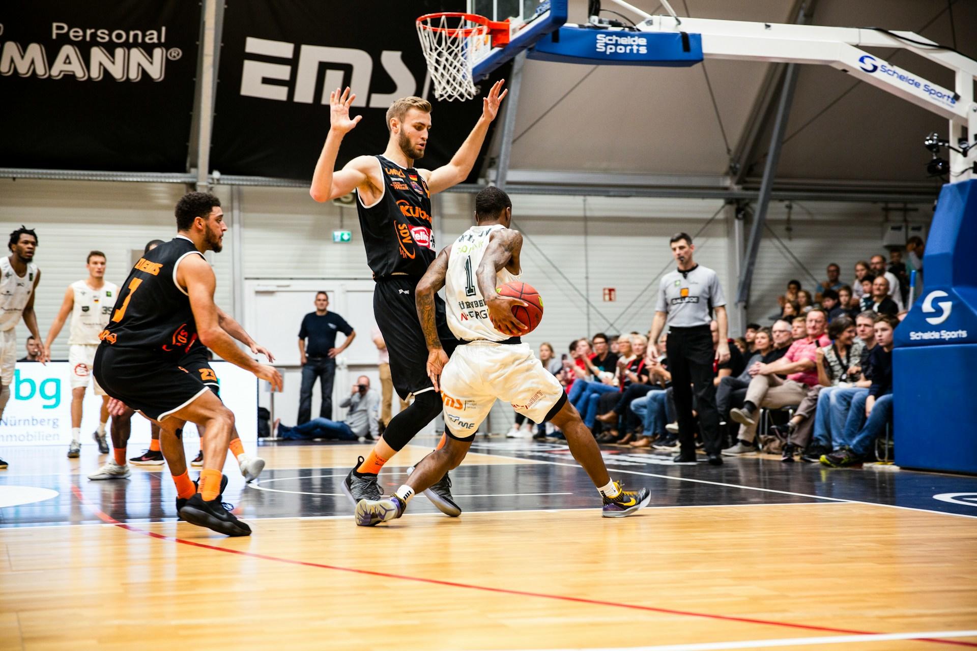 Small forward player in action during a basketball game.