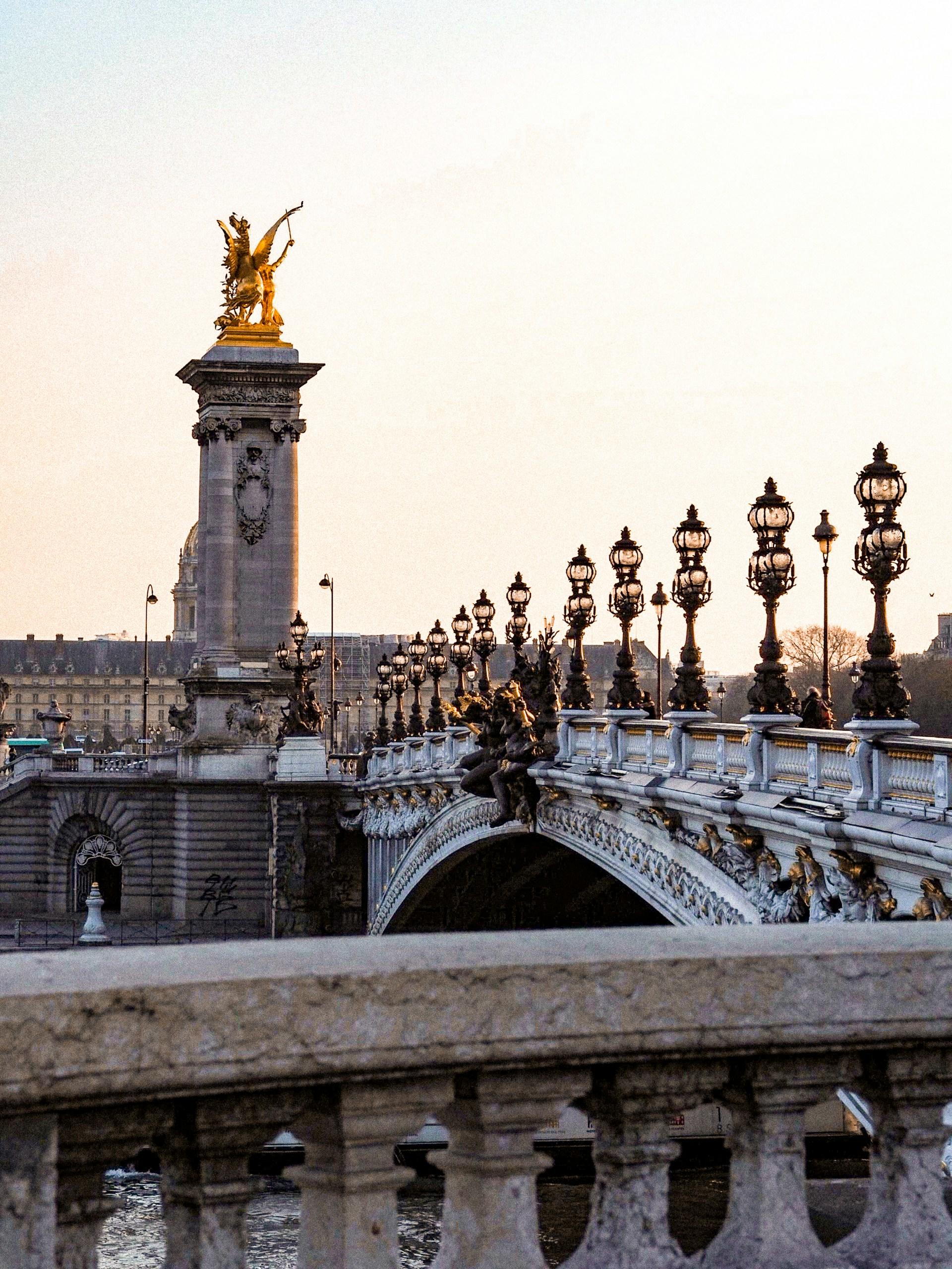 A stone bridge with ornamental lighting in the early morning light. 