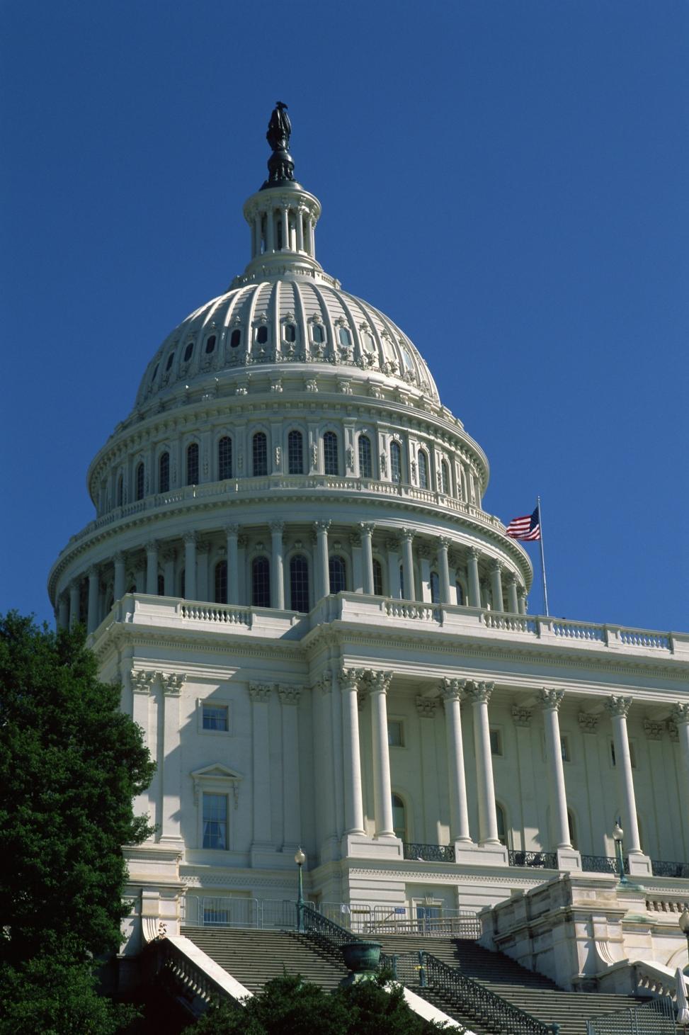 A large white building with columns and pillars.