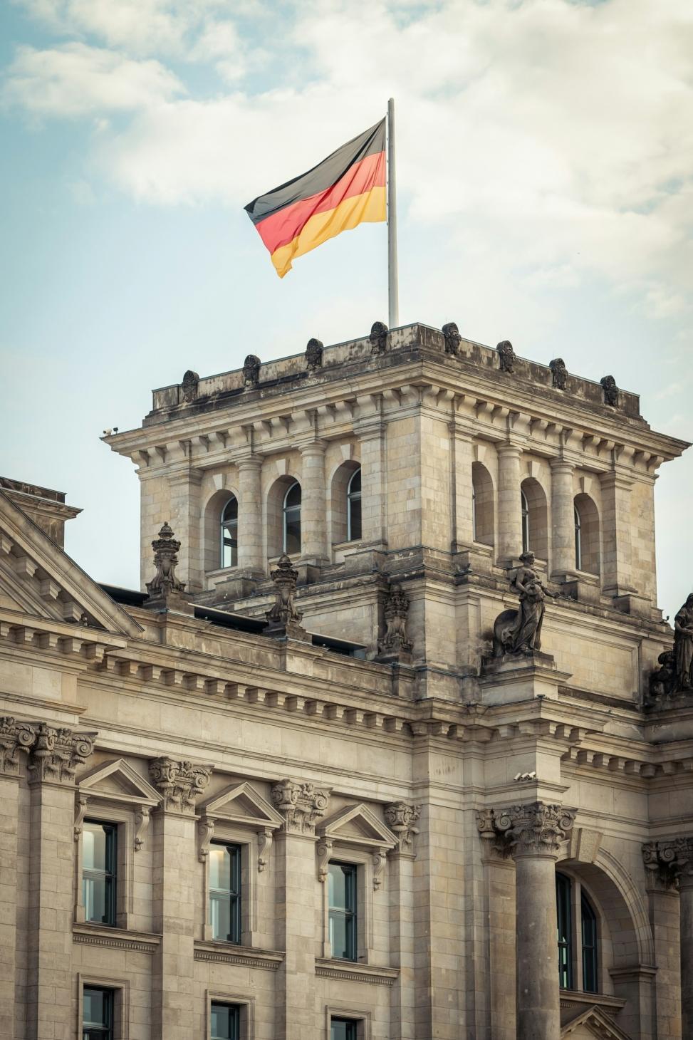 german flag over a historical building