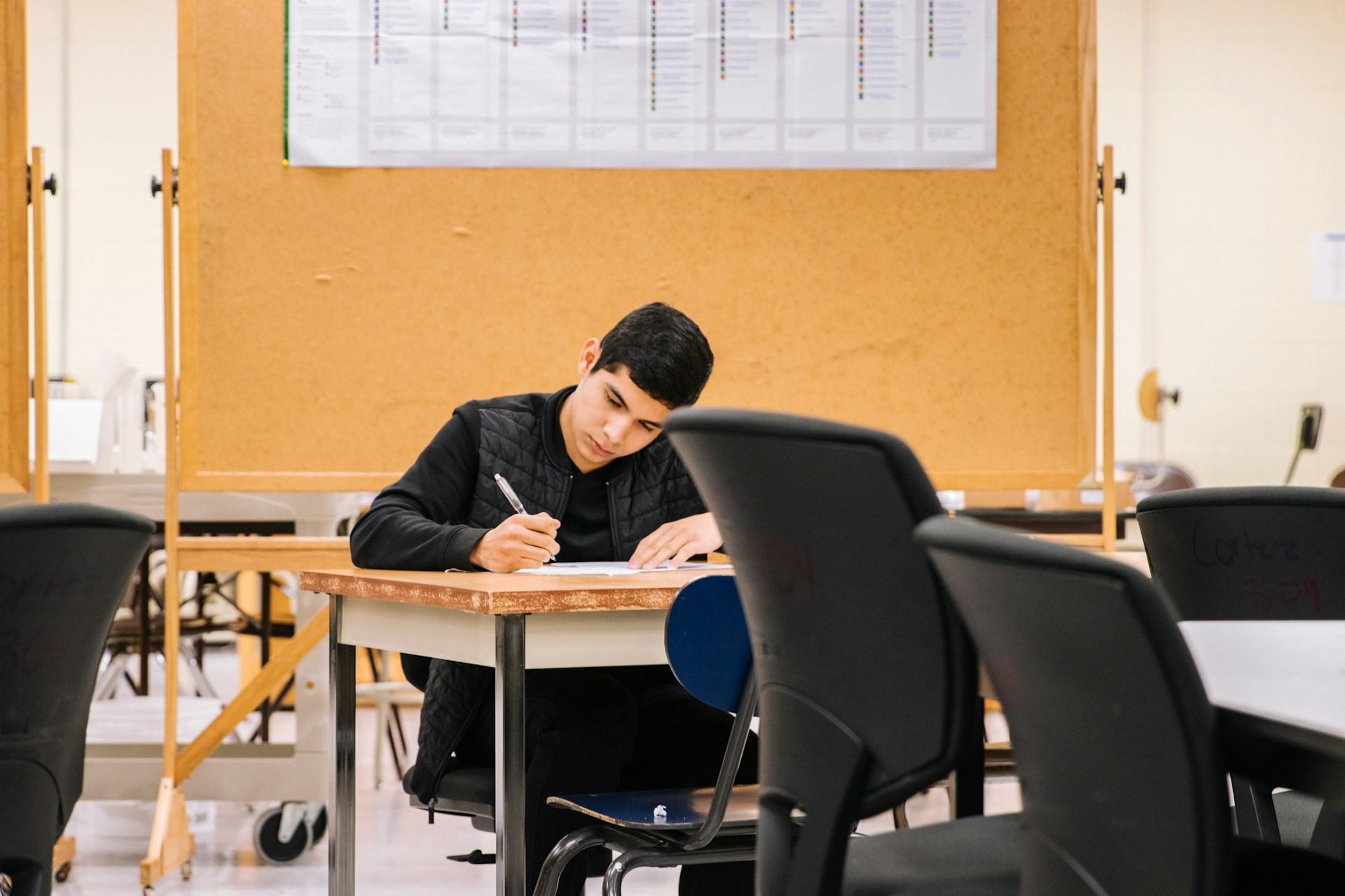 Student studying in a classroom.