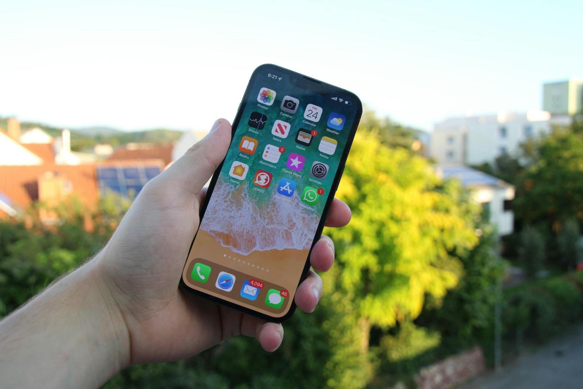 Cellphone being held up in the air.