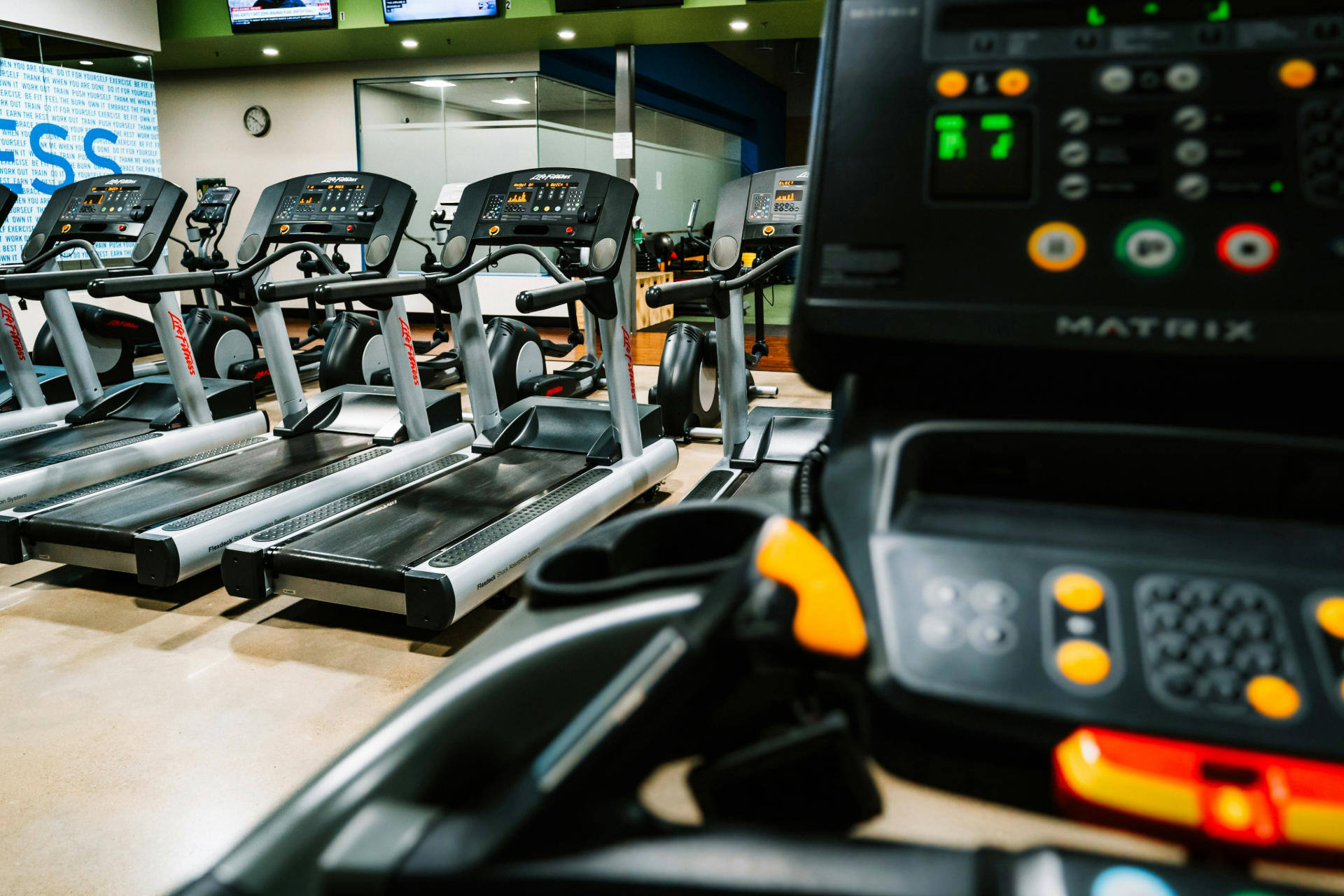 a row of treadmills in a gym