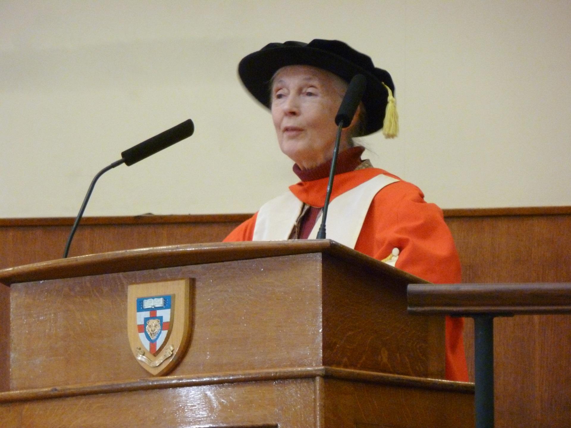 A woman speaking at a graduation ceremony.