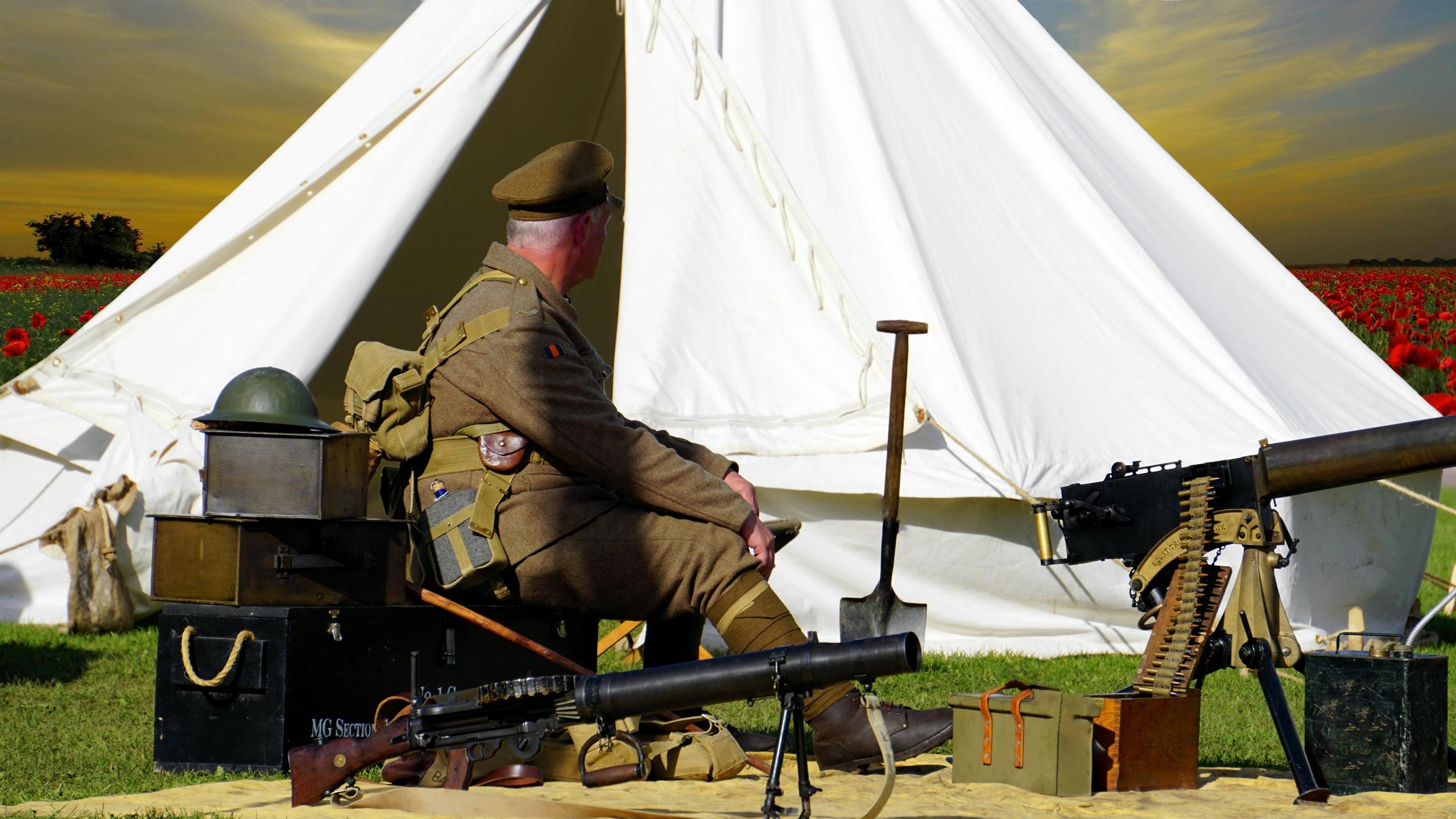 A soldier sitting down preparing to go into battle