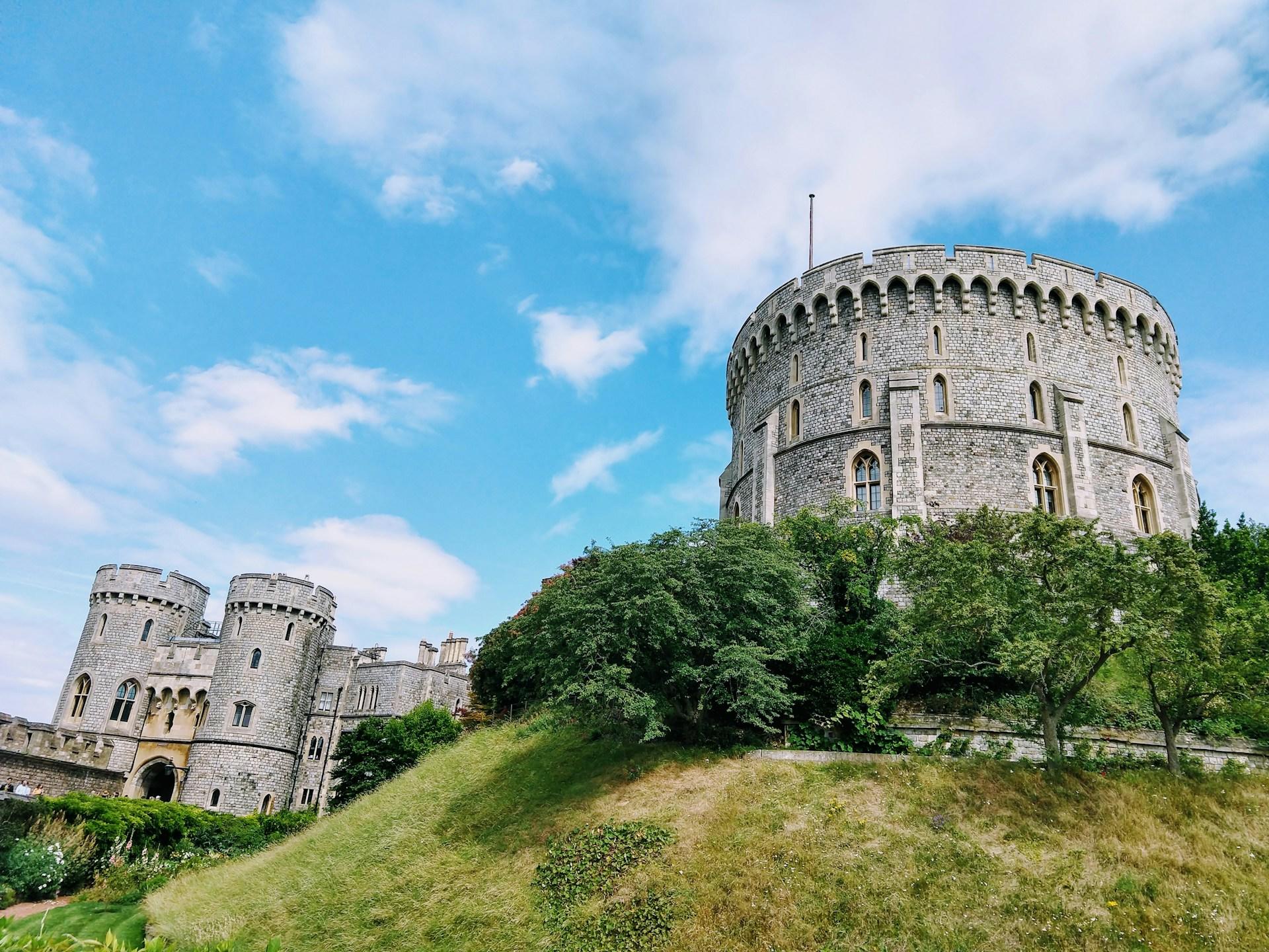 A castle on a hill on a sunny day.
