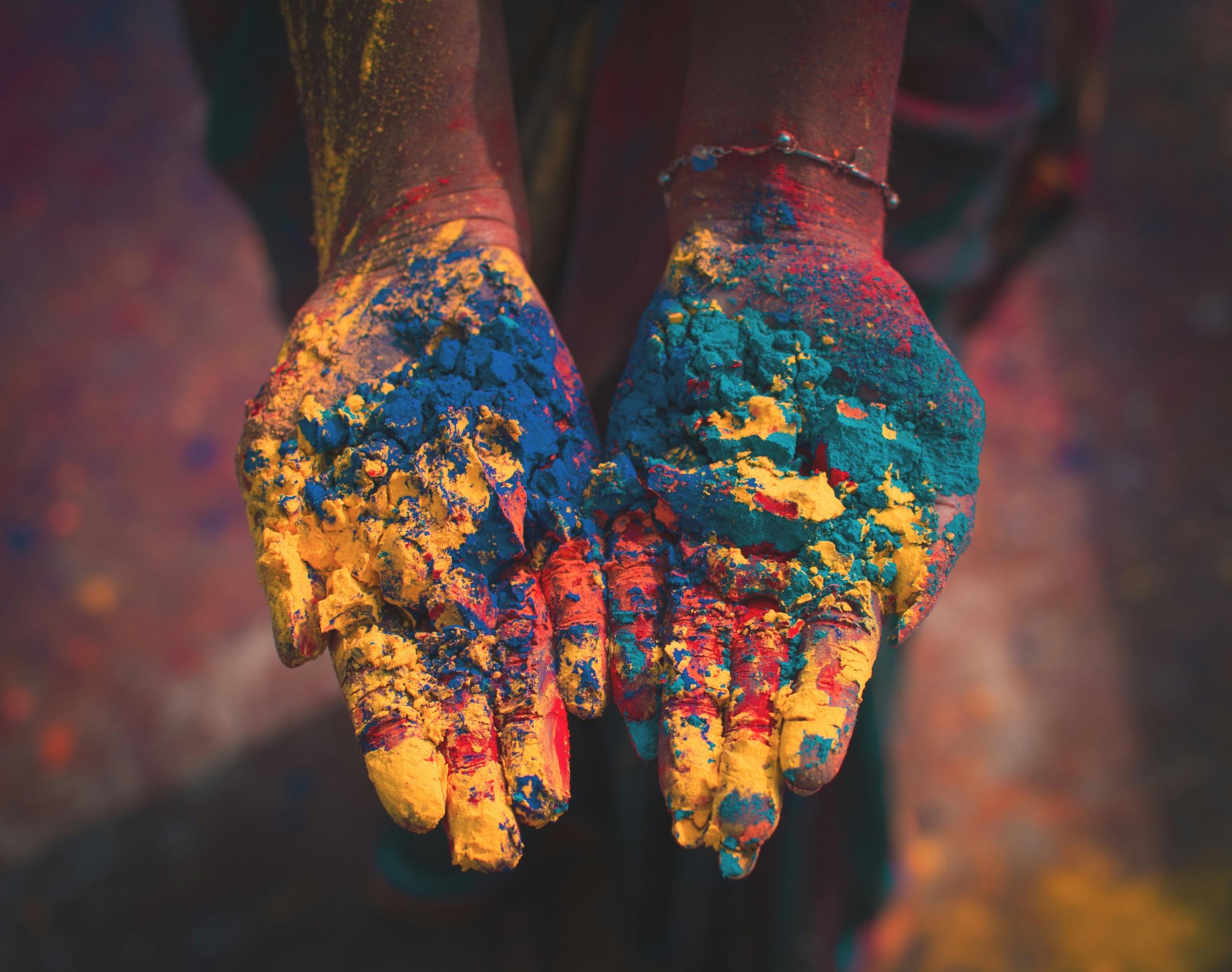 Hands with colour powder