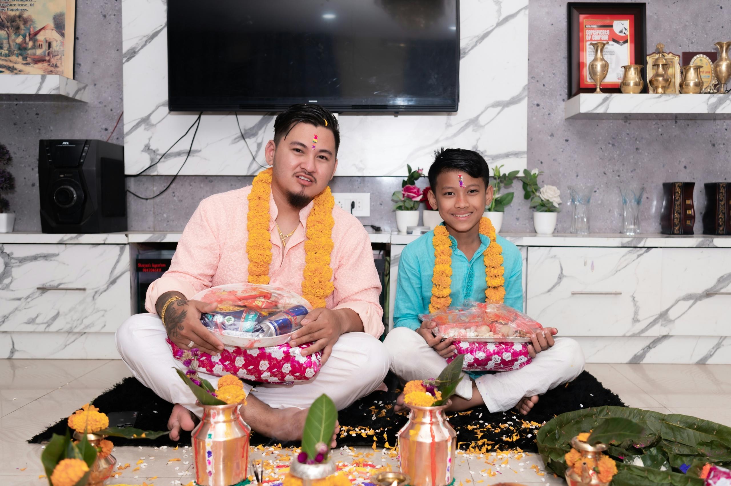 Father and son holding plates with food