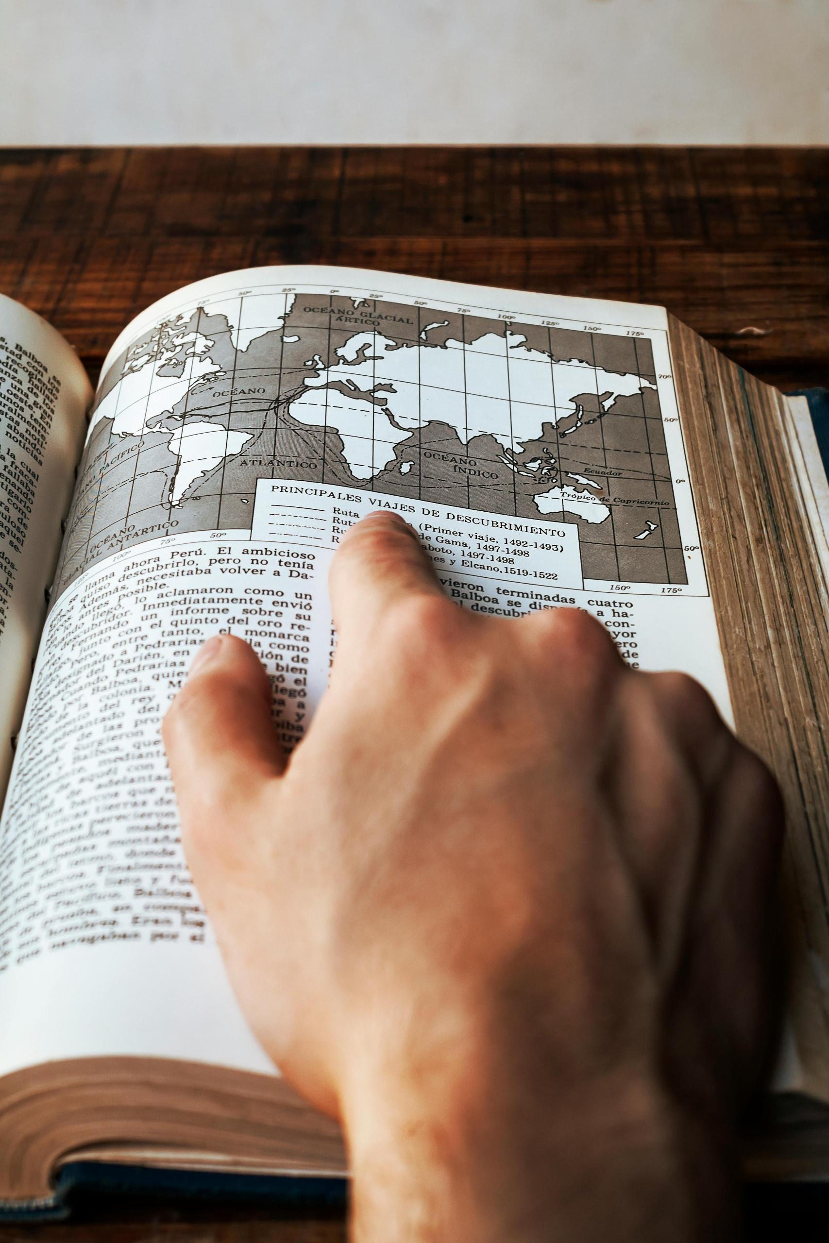 A student making use of the legend to find features on the map