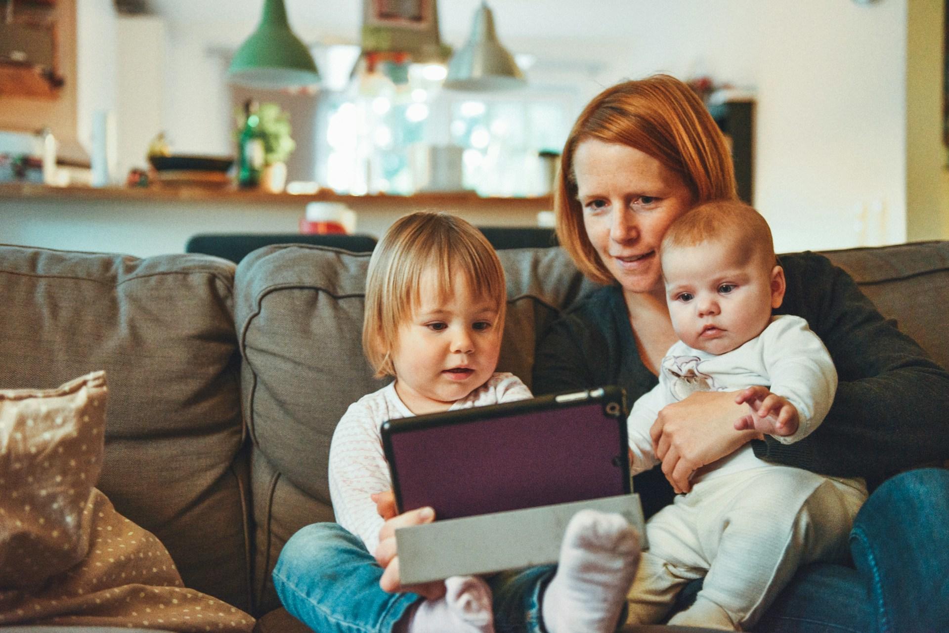 Mother and her two kids learning ASL at home.
