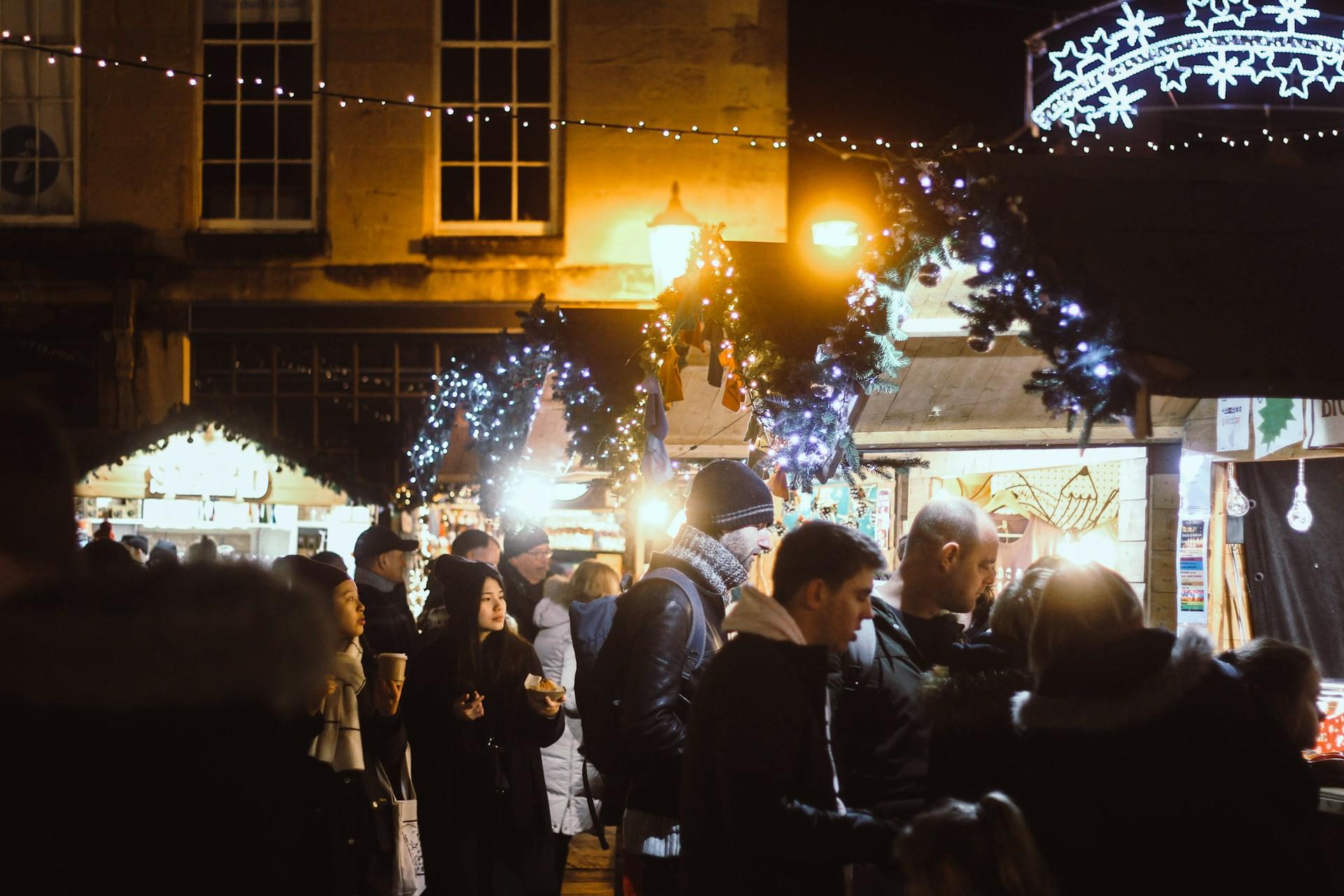 People walking around a Christmas market.