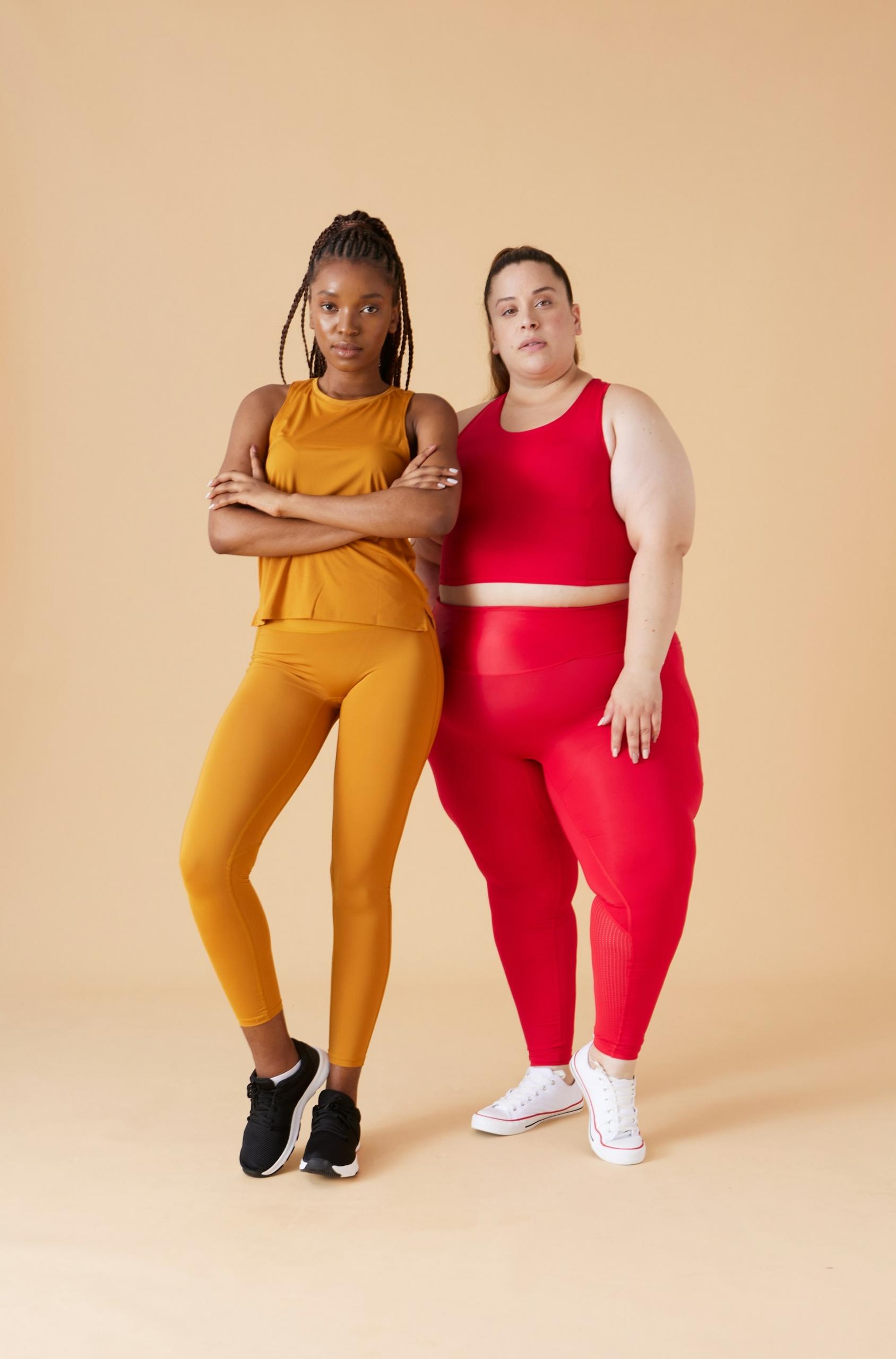 Two women in gym clothing. 