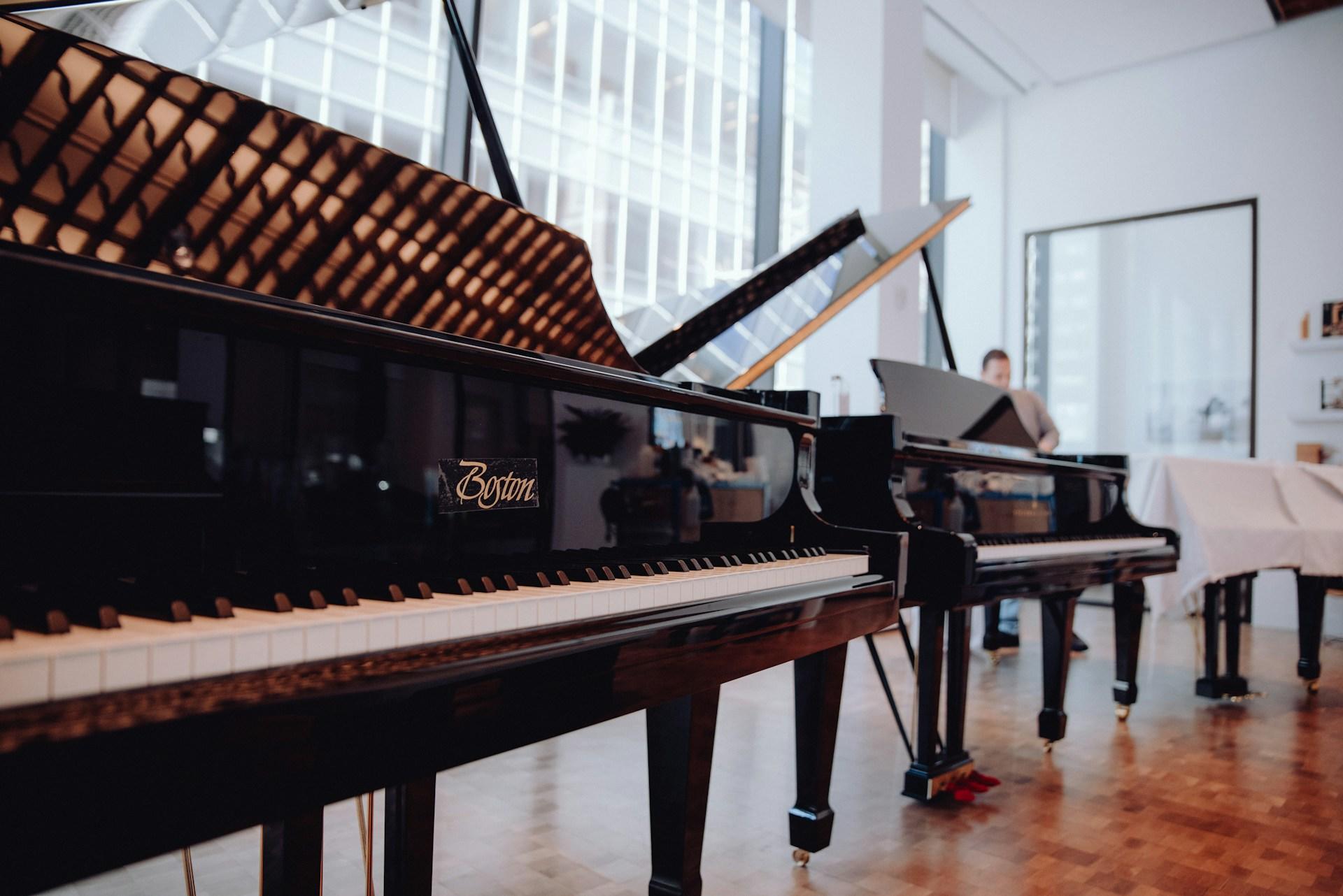 Steinway pianos in a showroom.