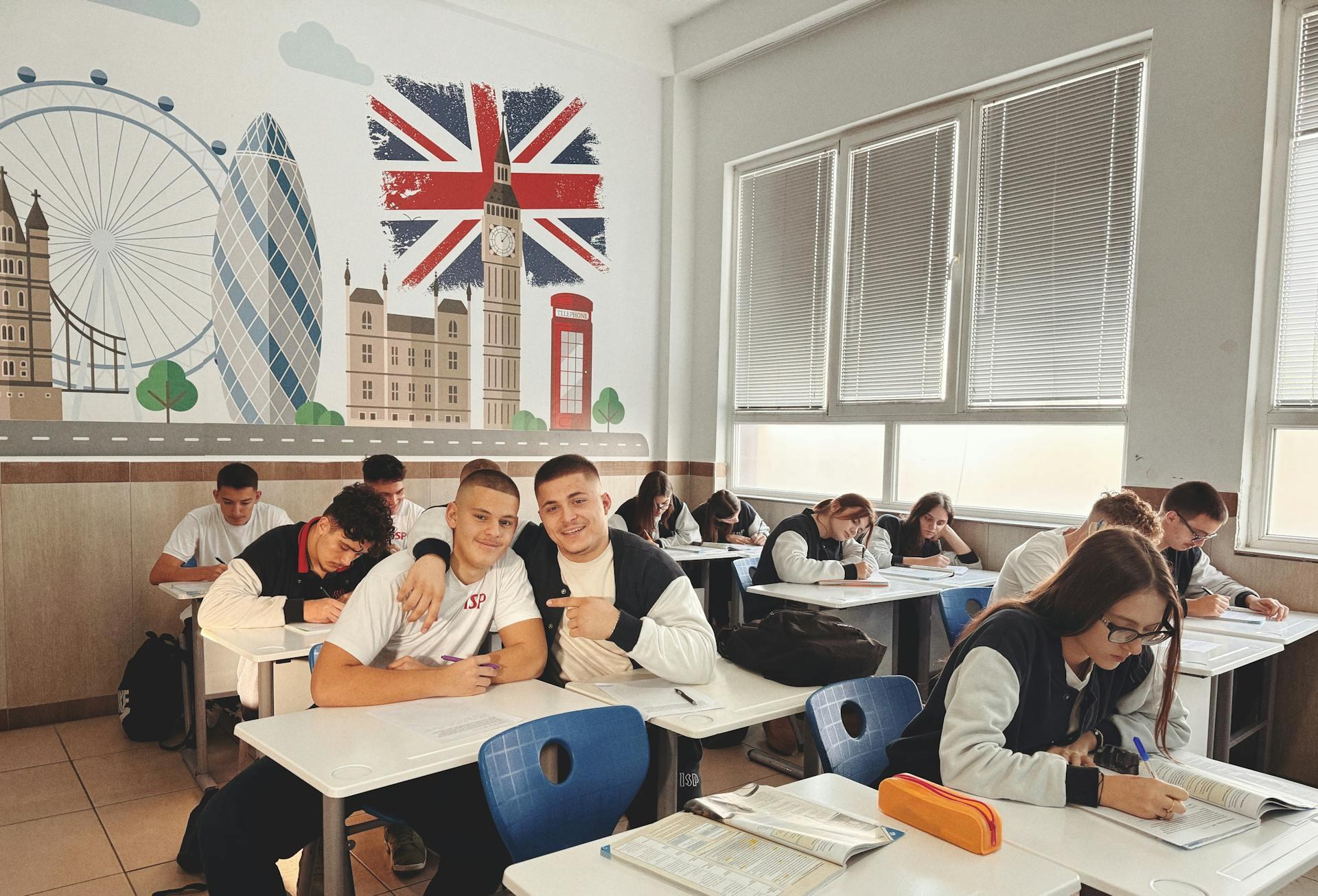 Students in class with a London background mural on the wall