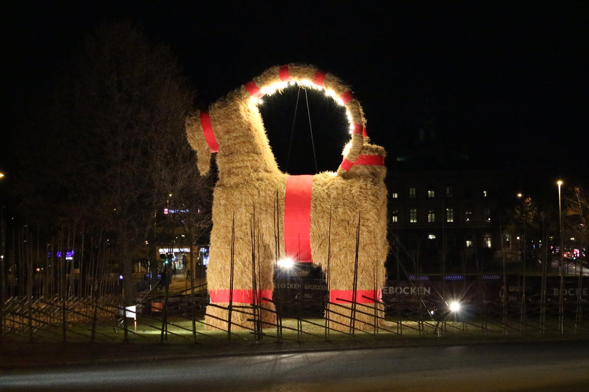 Illuminated yule goat statue in Sweden.